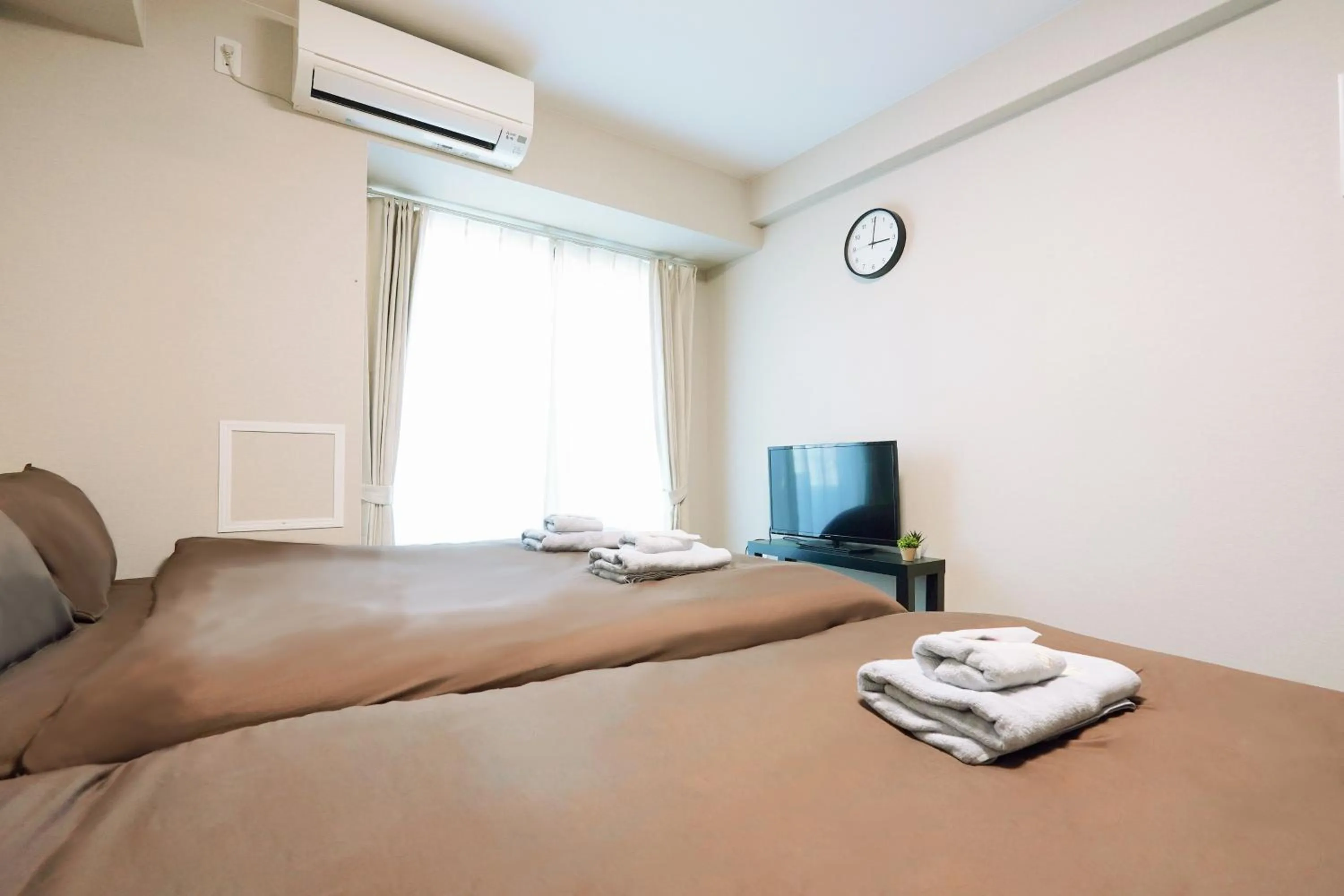 Bed in nestay apartment osaka ebisu