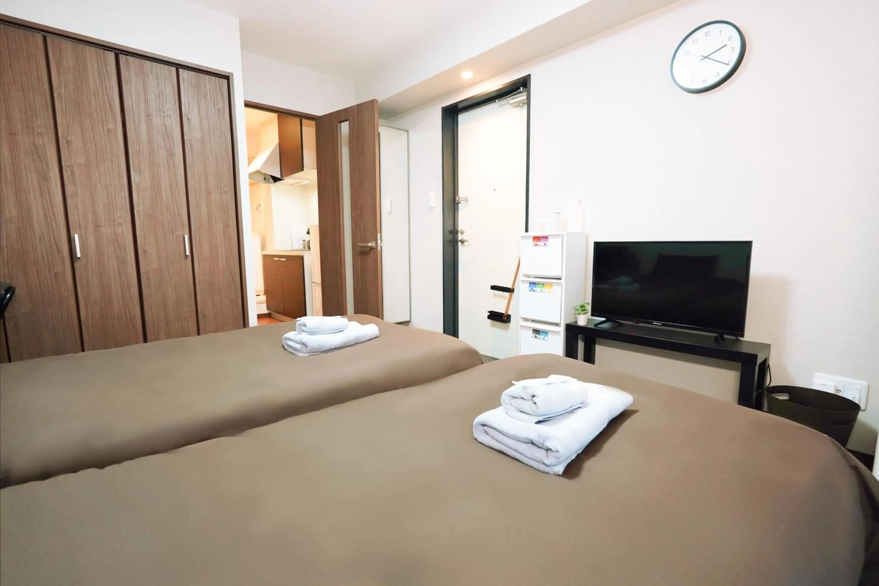 Bed in nestay apartment osaka ebisu