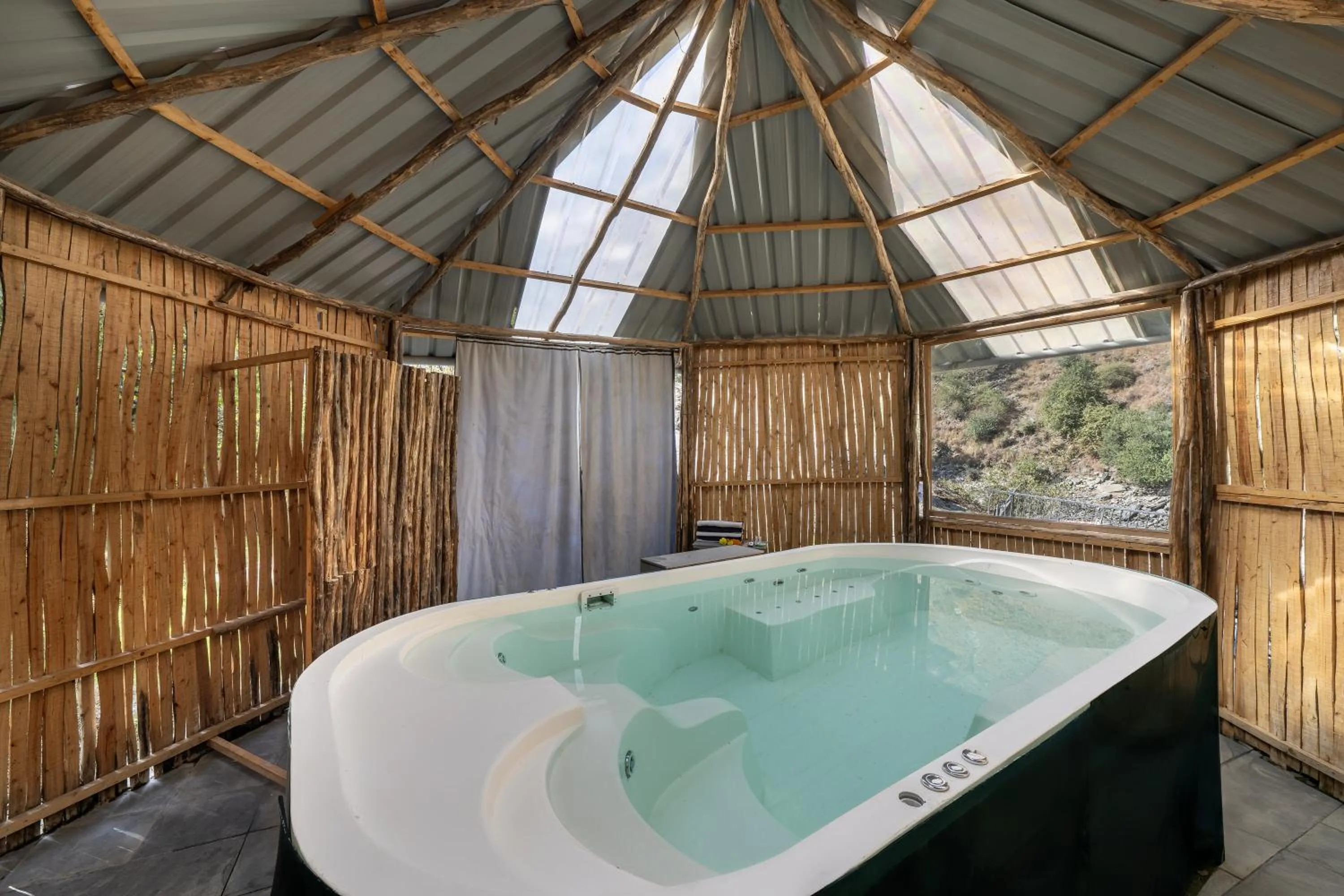 Hot Tub in Echor Palm Bliss Riverside Resort & Spa Kasol