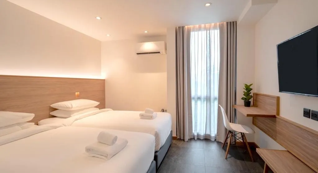 Bed in ZEN MASTER HOTEL