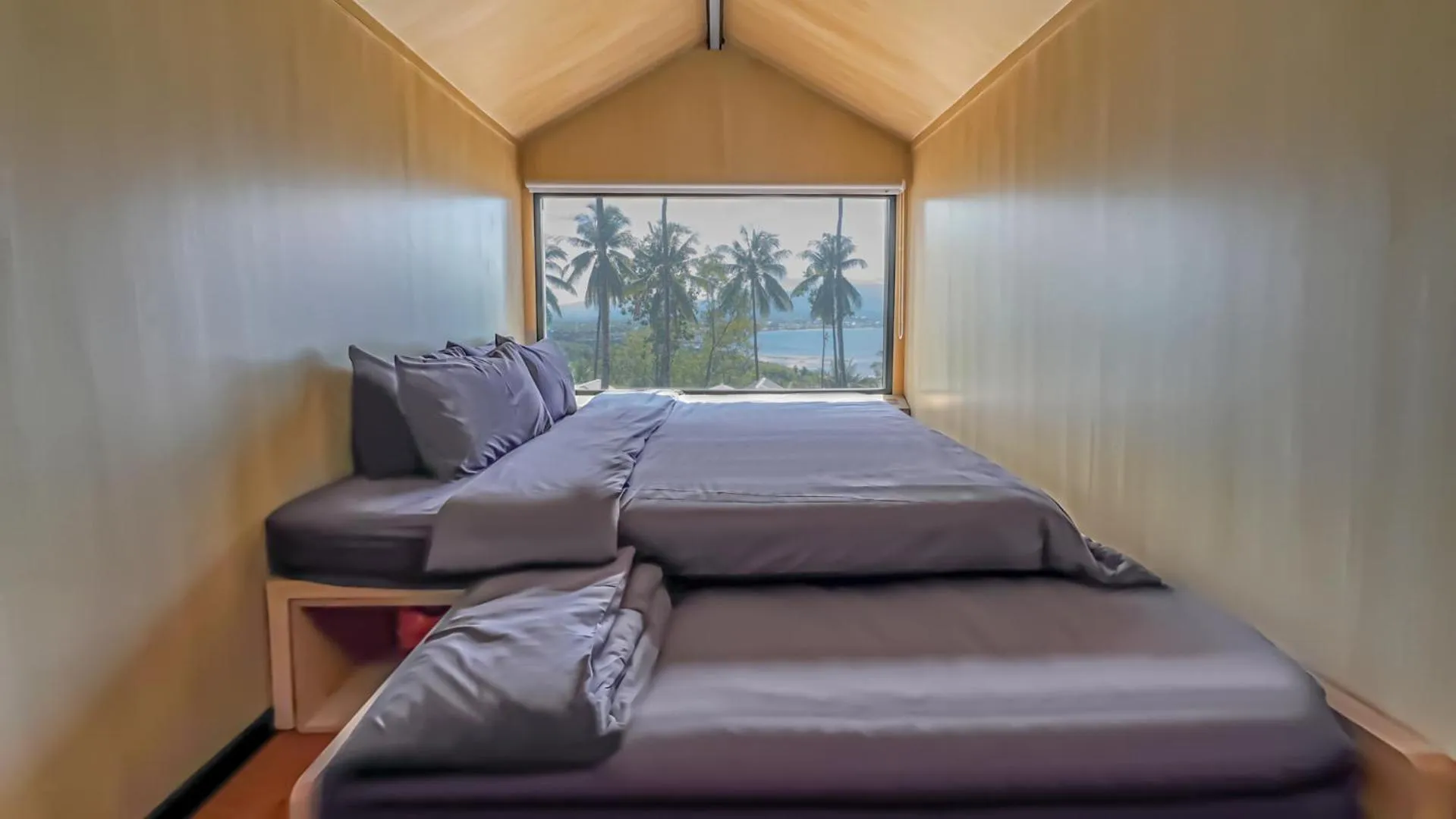 Bed in Bobocabin Bunaken Hills, Manado