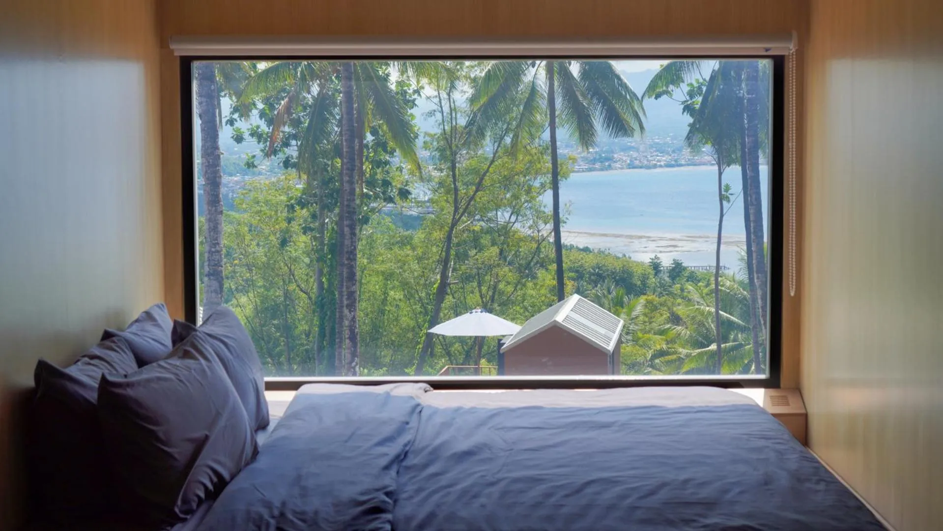 Bed in Bobocabin Bunaken Hills, Manado