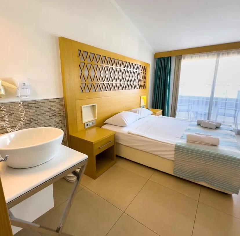 Bed in Aurasia Design Hotel