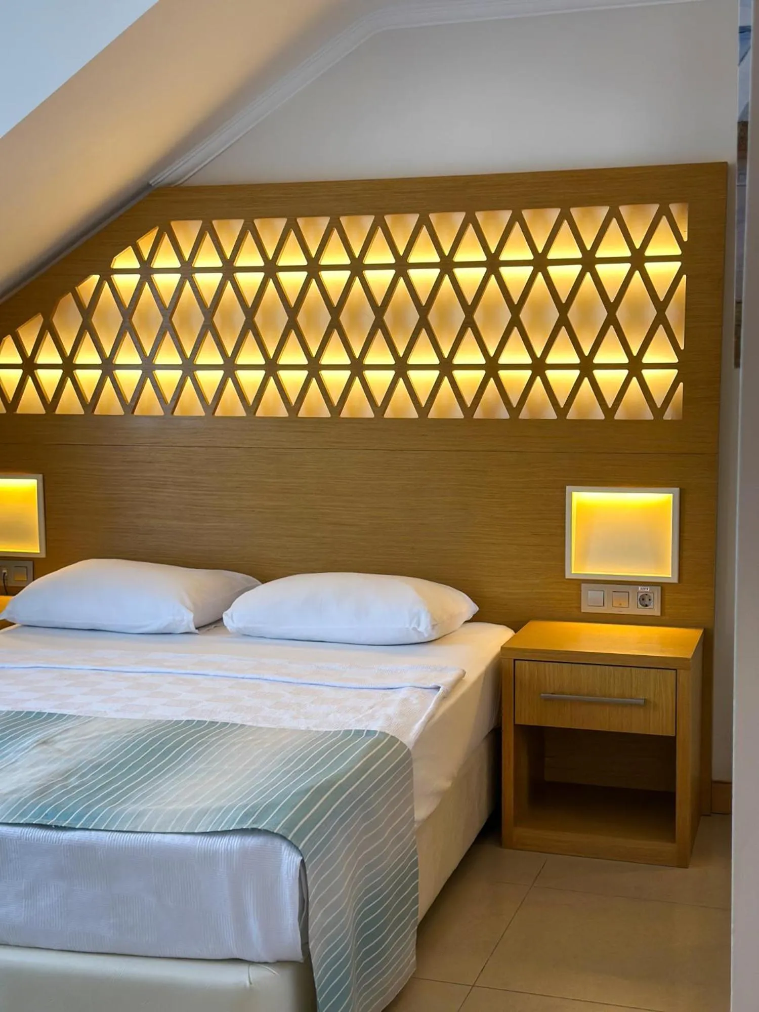 Bed in Aurasia Design Hotel