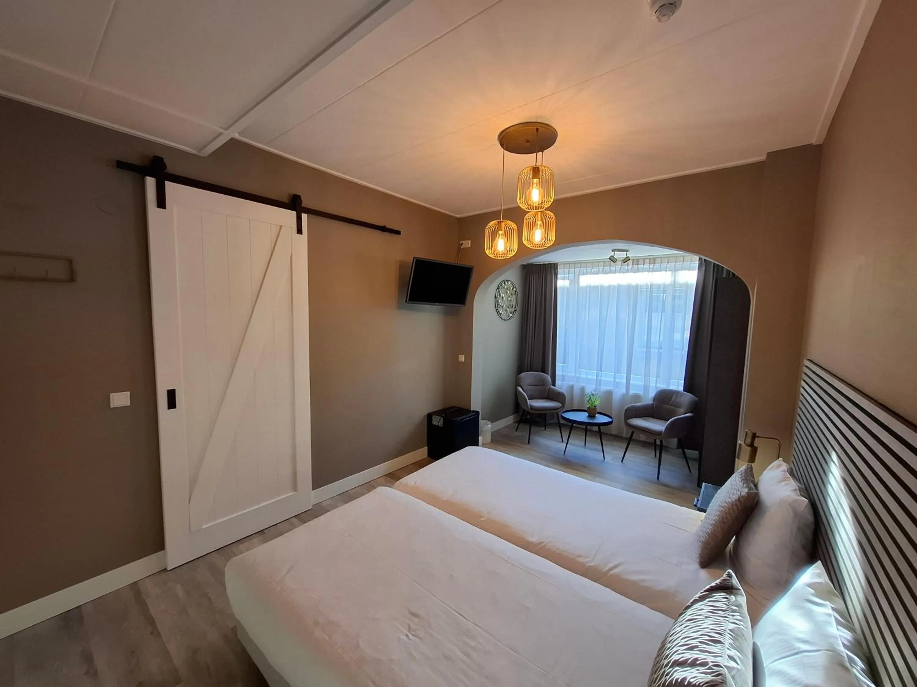 Seating area, Bed in Hotel Randduin