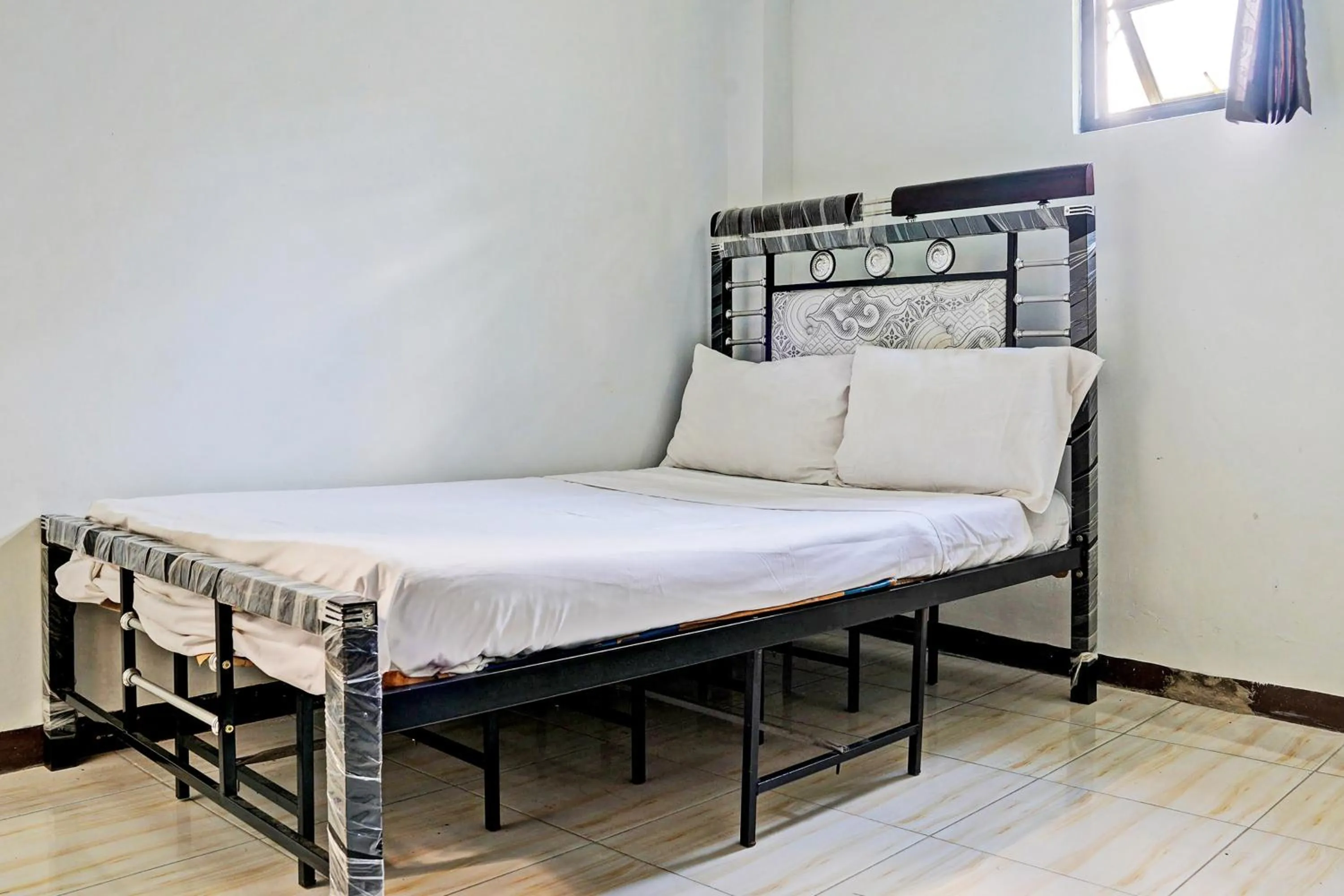 Bedroom in Hotel O Penginapan Hj Lilis 2 Syariah