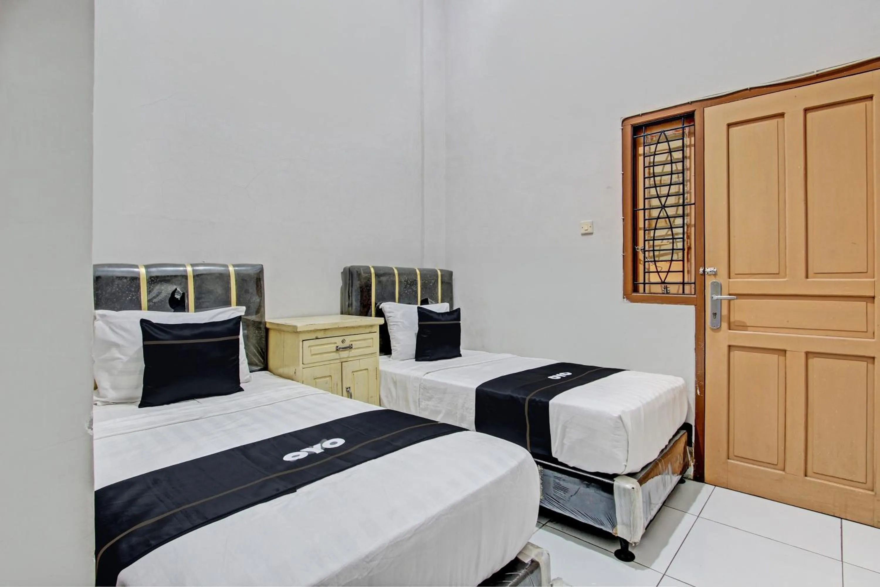 Bedroom, Bed in Capital O 93361 Dynasty Inn Syariah