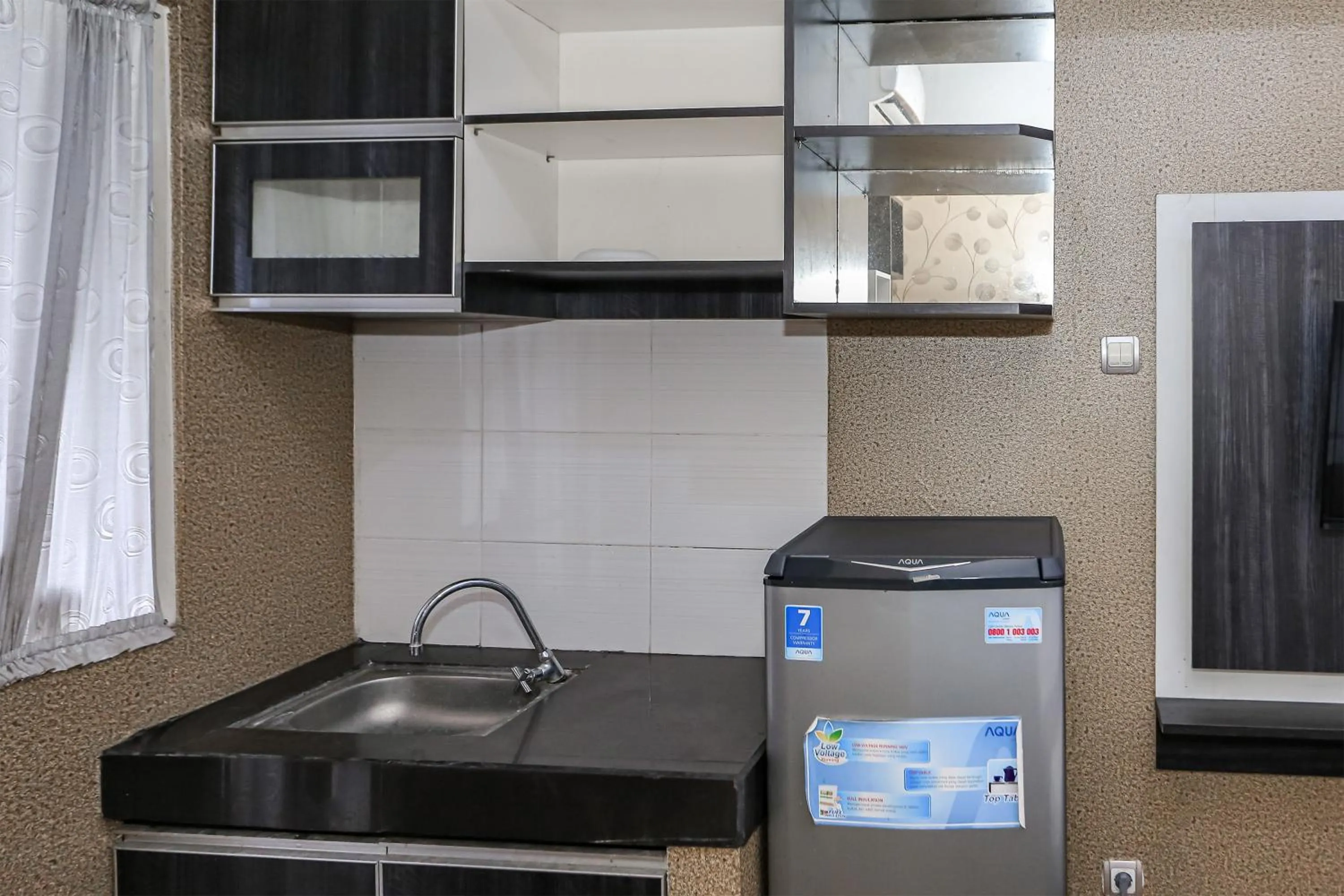 Bedroom in Capital O 93372 Aurora Residence