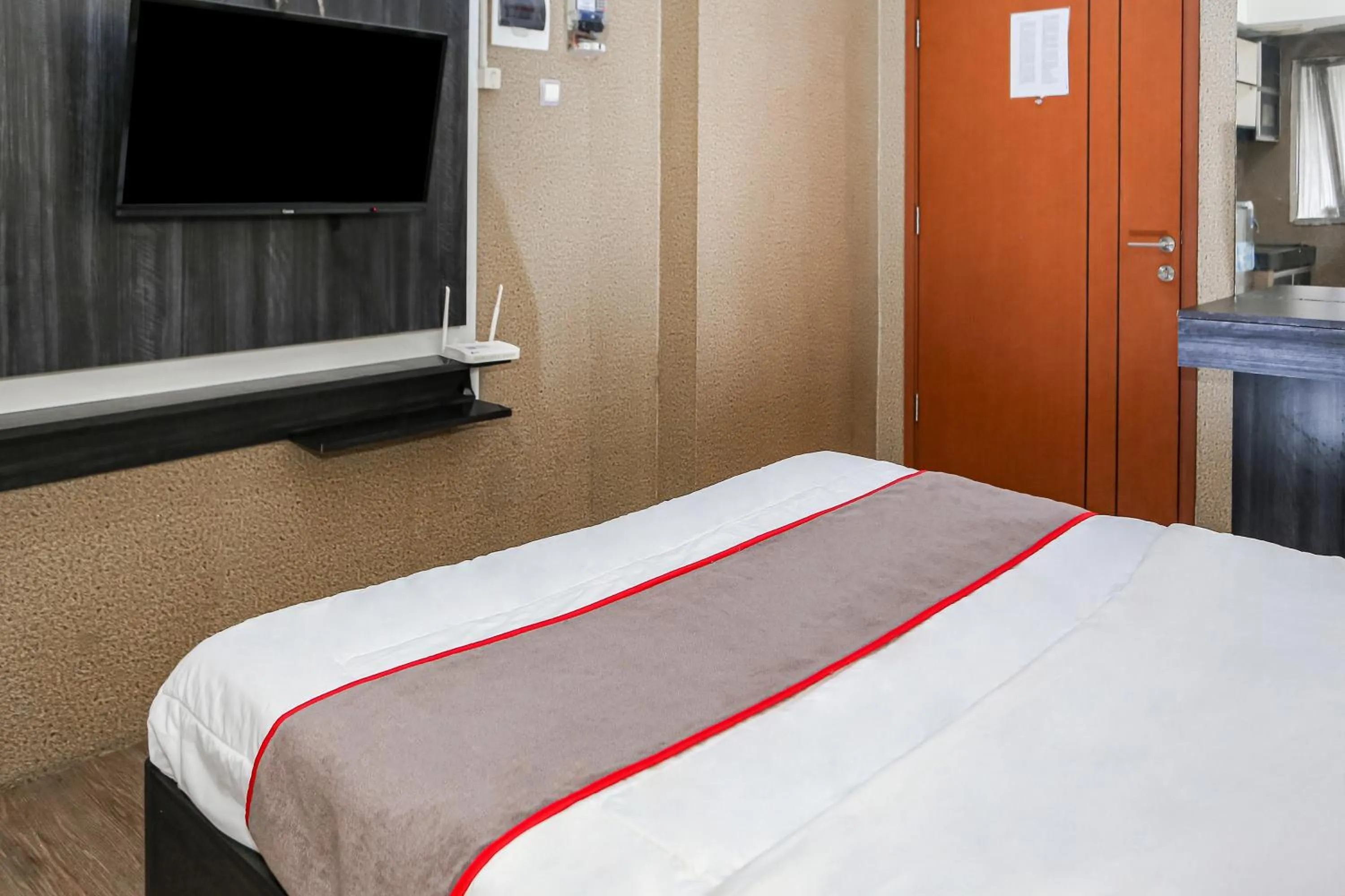 Bedroom, Bed in Capital O 93372 Aurora Residence