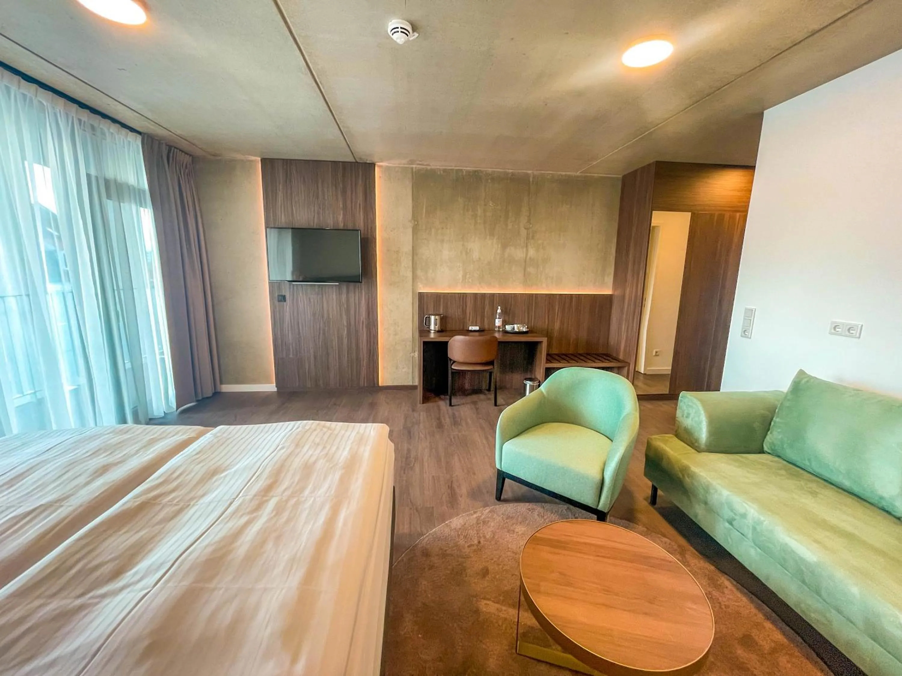 Bed in DX Apartments