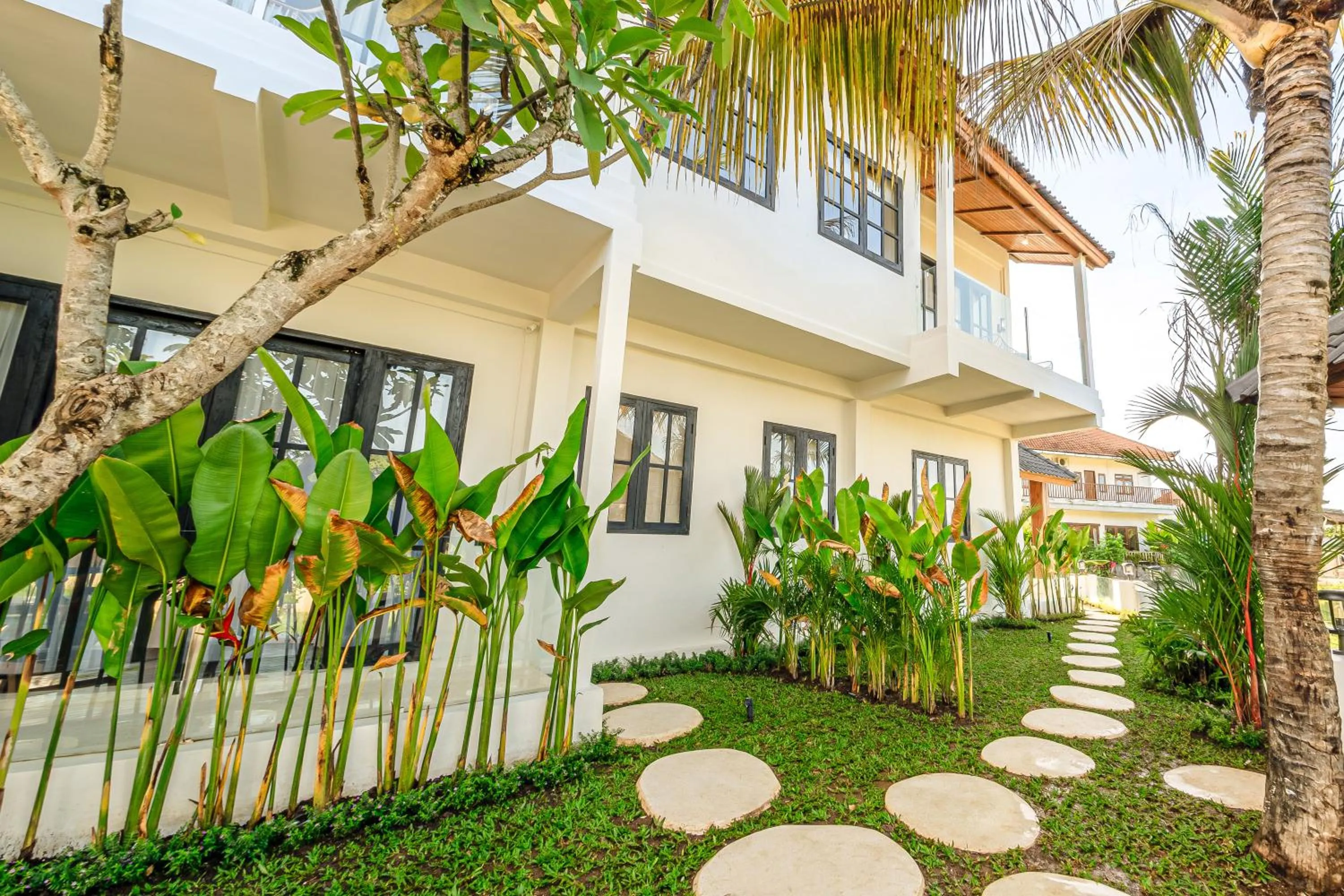 Property building in Sarang Apartments by EVDEkimi - Rice field escape with Yoga lounge, Lush garden - Long stay extras