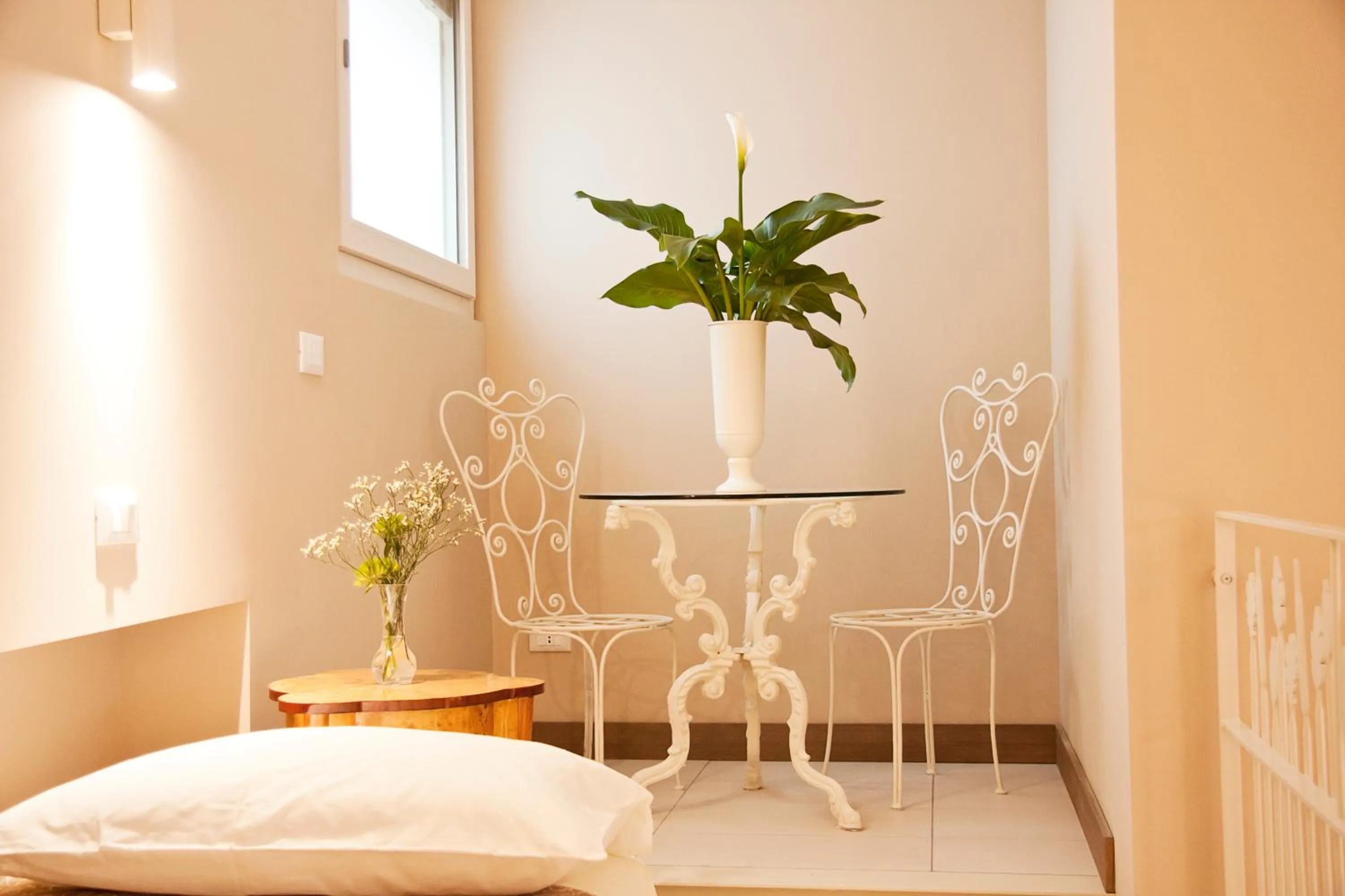 Seating area, Bed in La Castellana Loft Hotel