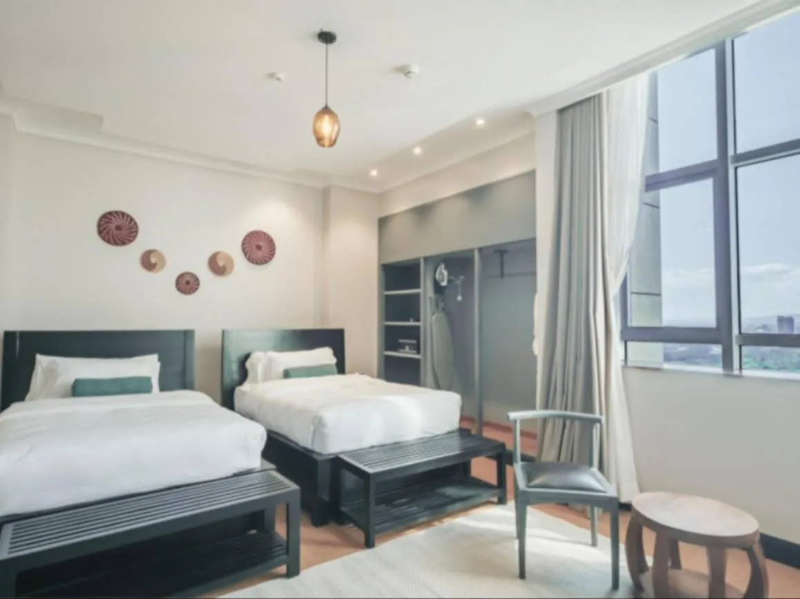 Seating area, Bed in Sanna Boutique Hotel