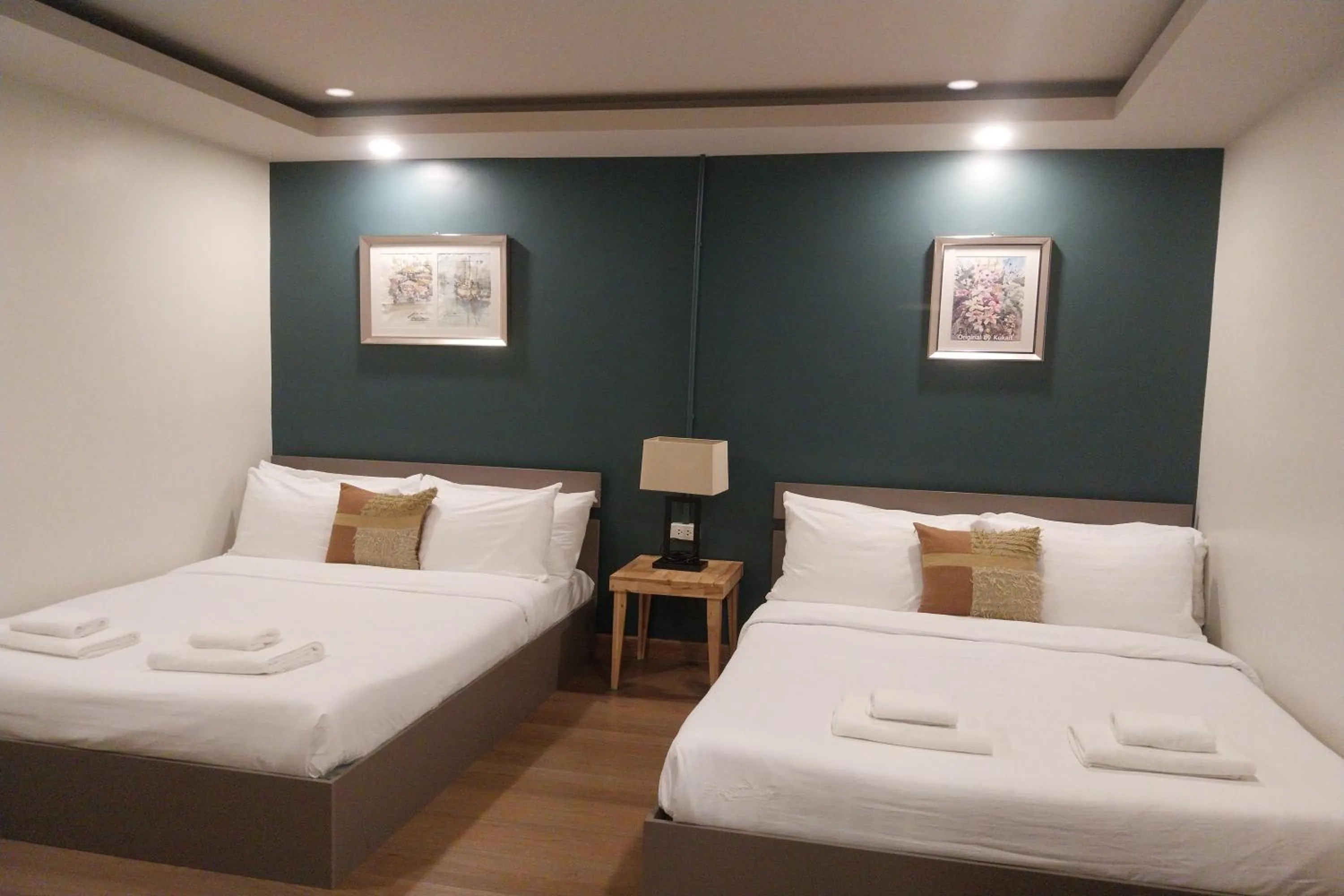 Bed in Ployburi Boutique Hotel