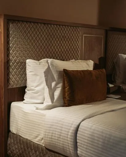 Bed in City Hotel by Waves