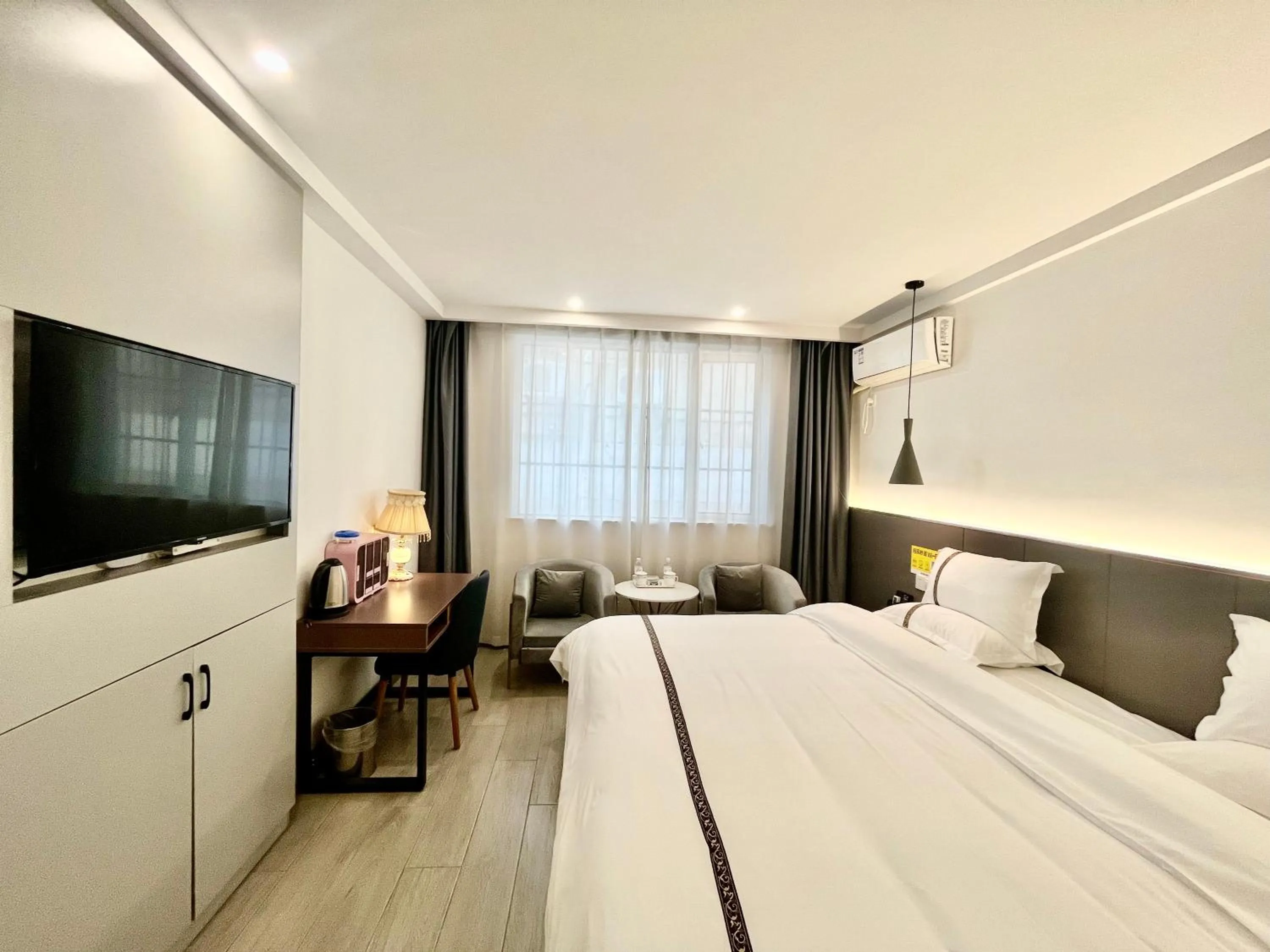 Communal lounge/ TV room, Bed in Tianshui Times Hotel Zhangjiagang