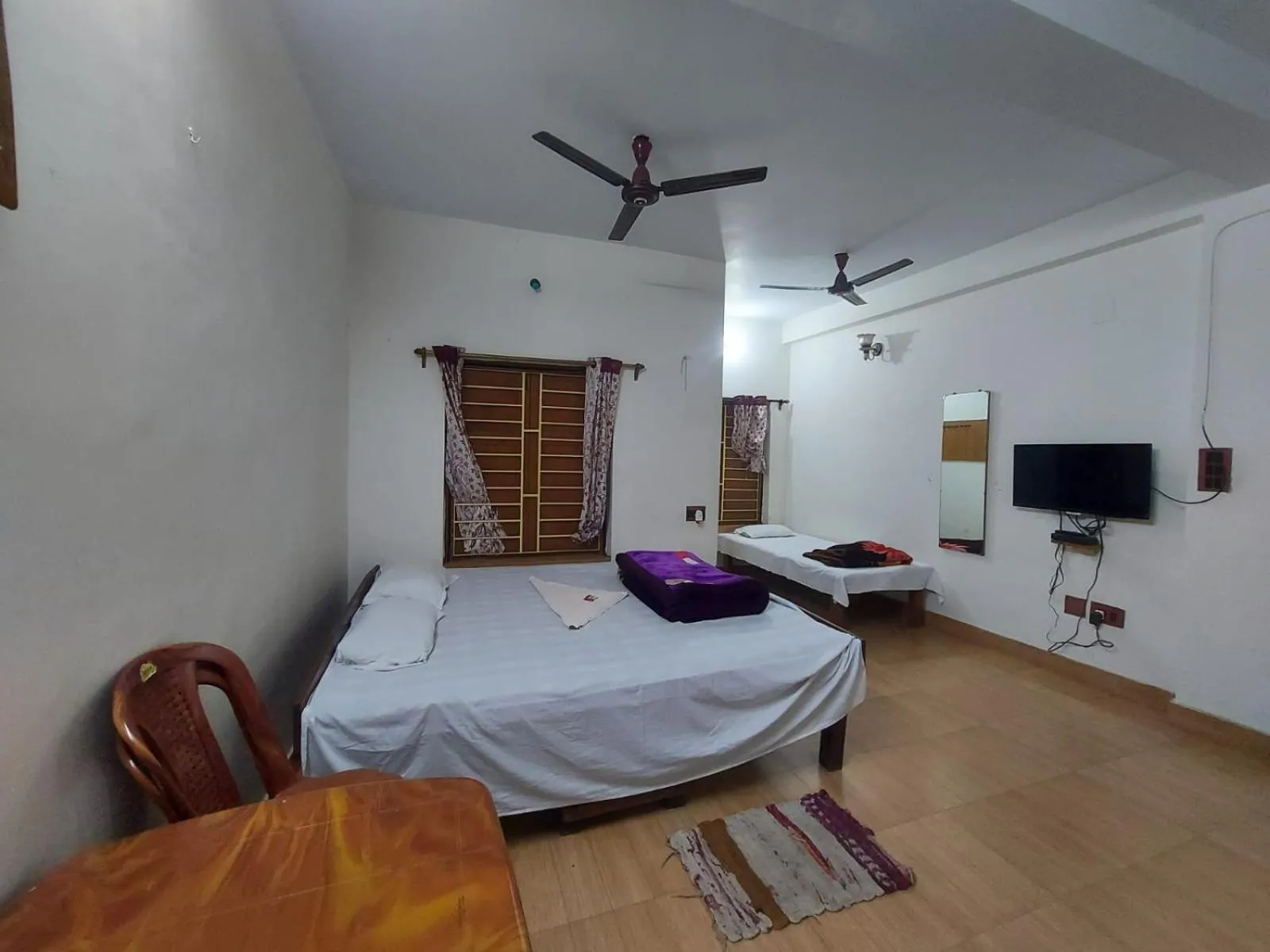 Bedroom, Bed in Rajlaxmi Resort - Pure Veg