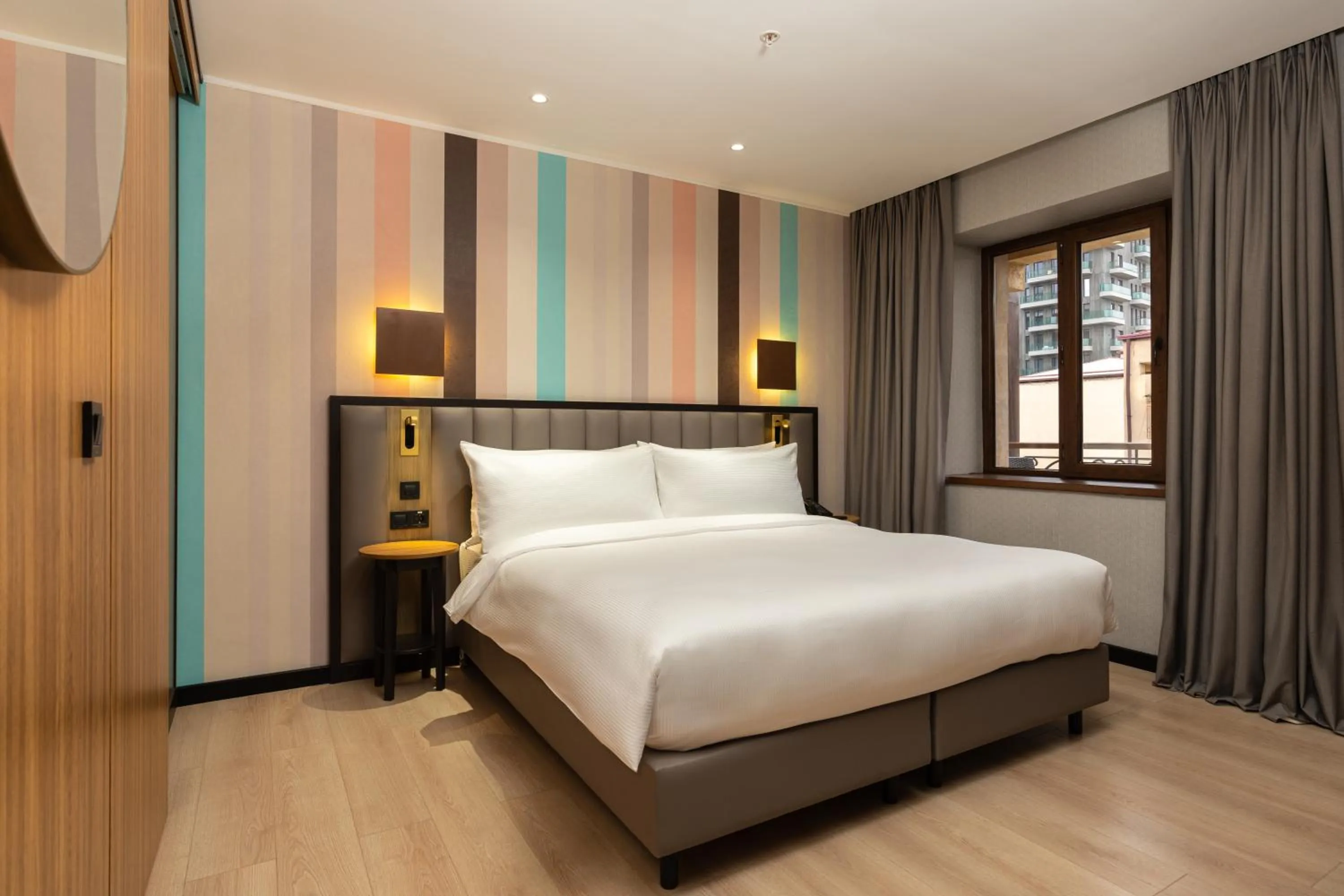 Bed in Ramada Encore by Wyndham Tashkent