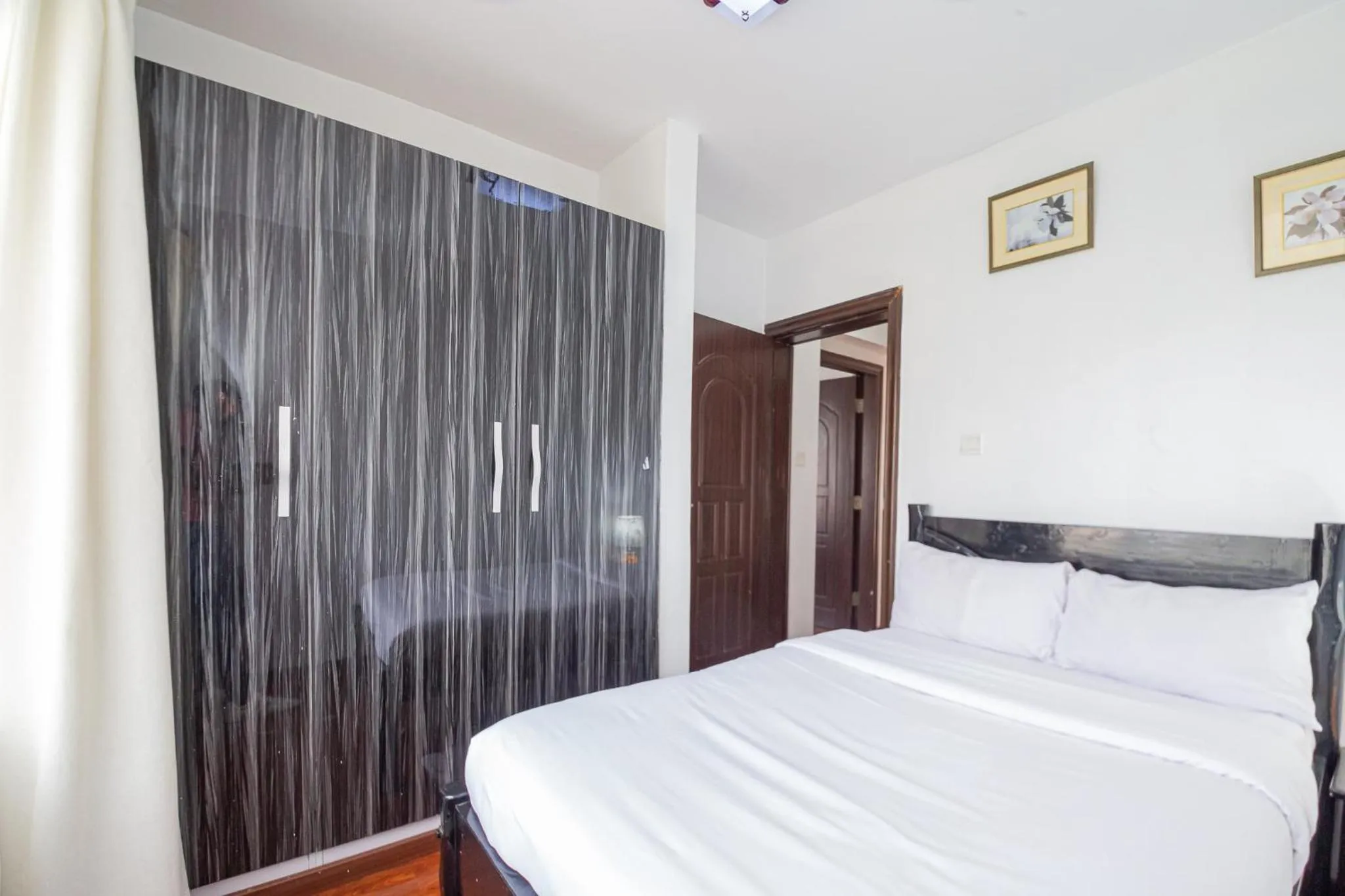 Bed in Eldon Apartments & Suites