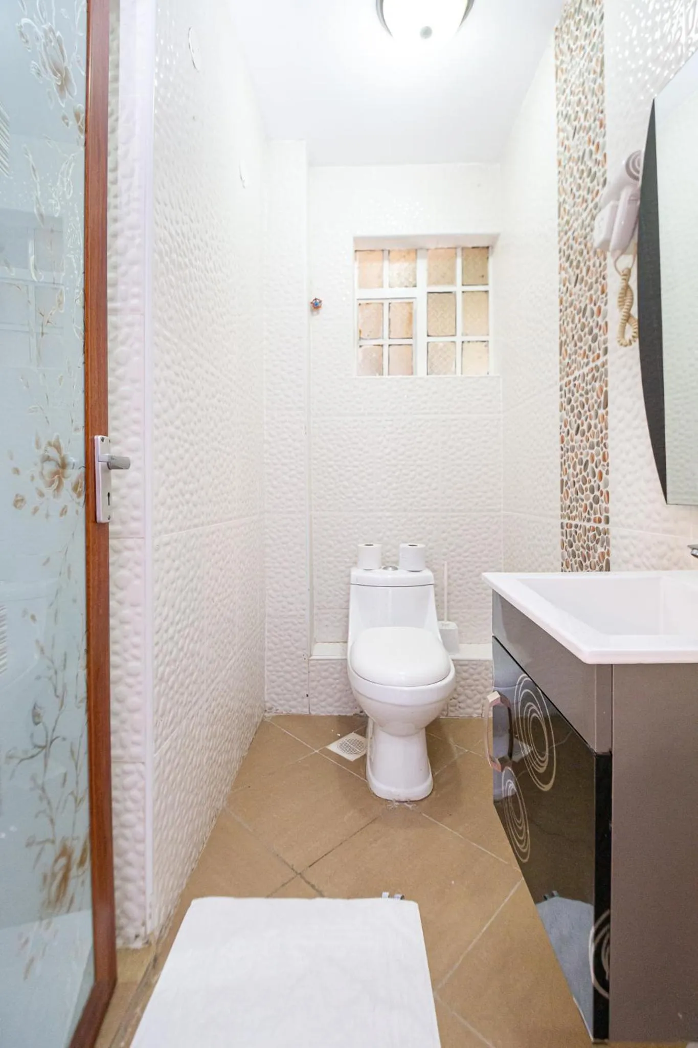 Toilet in Eldon Apartments & Suites