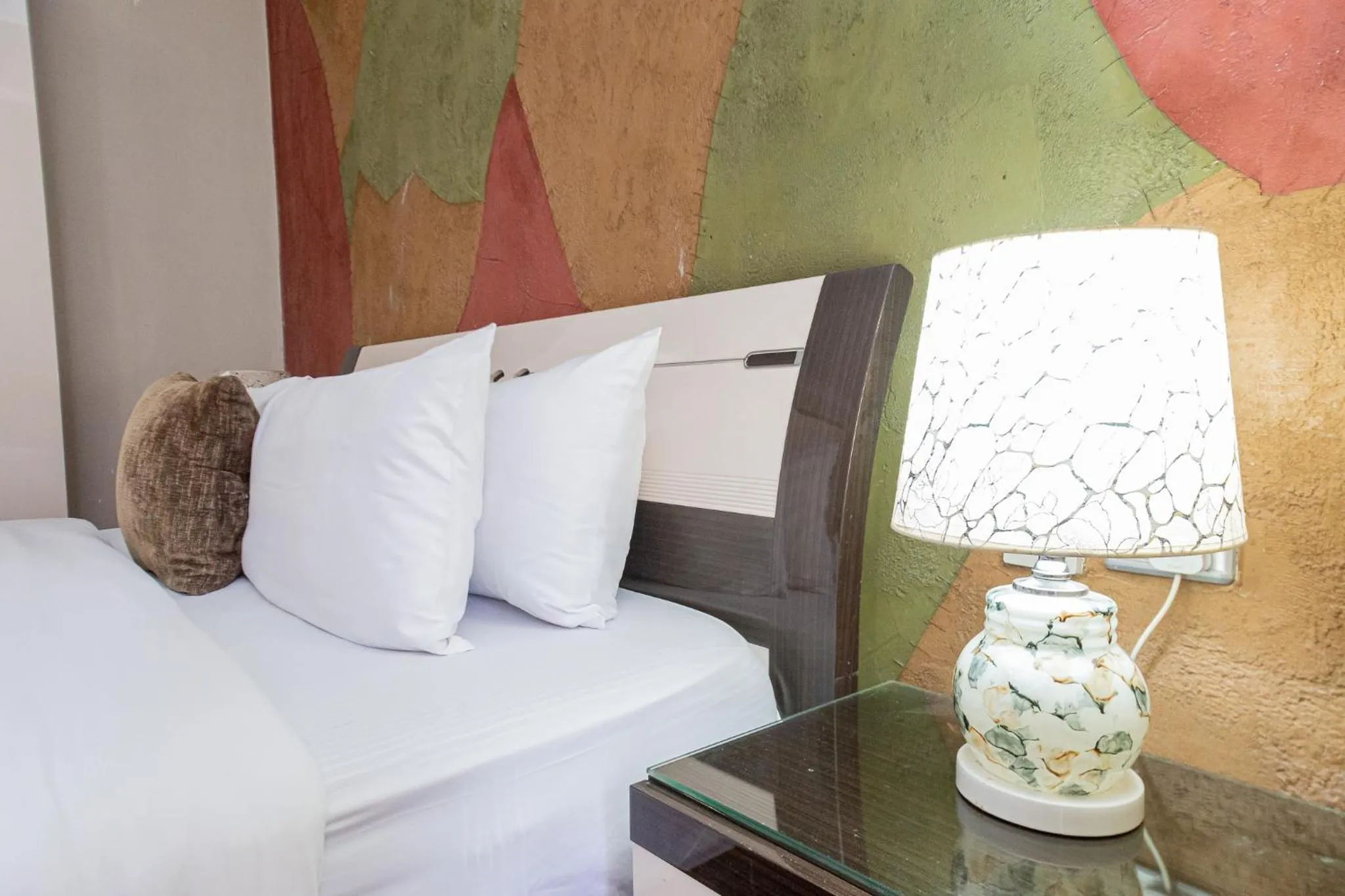 Bed in Eldon Apartments & Suites