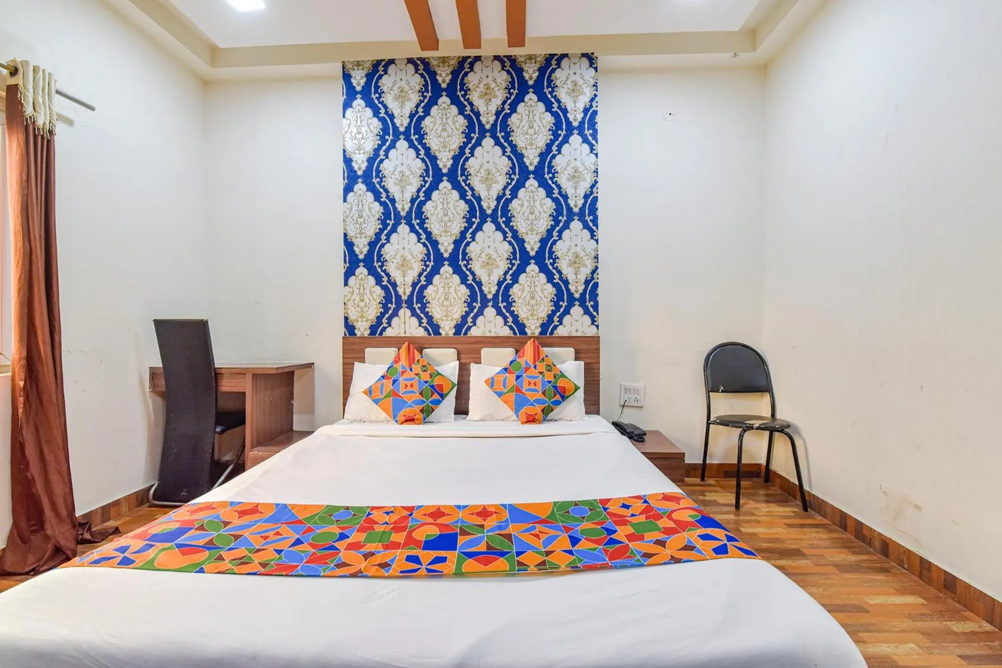 Bed in FabHotel Shri Shyam Palace