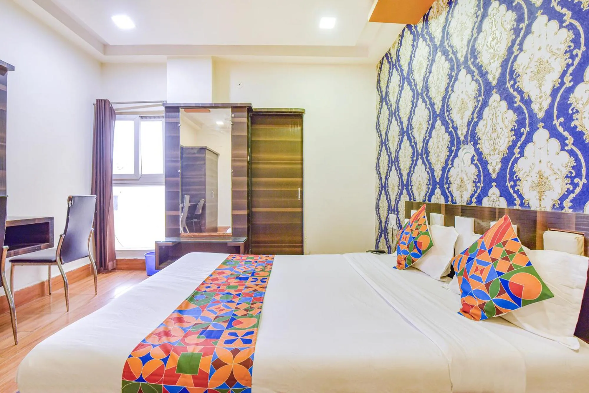 Bed in FabHotel Shri Shyam Palace