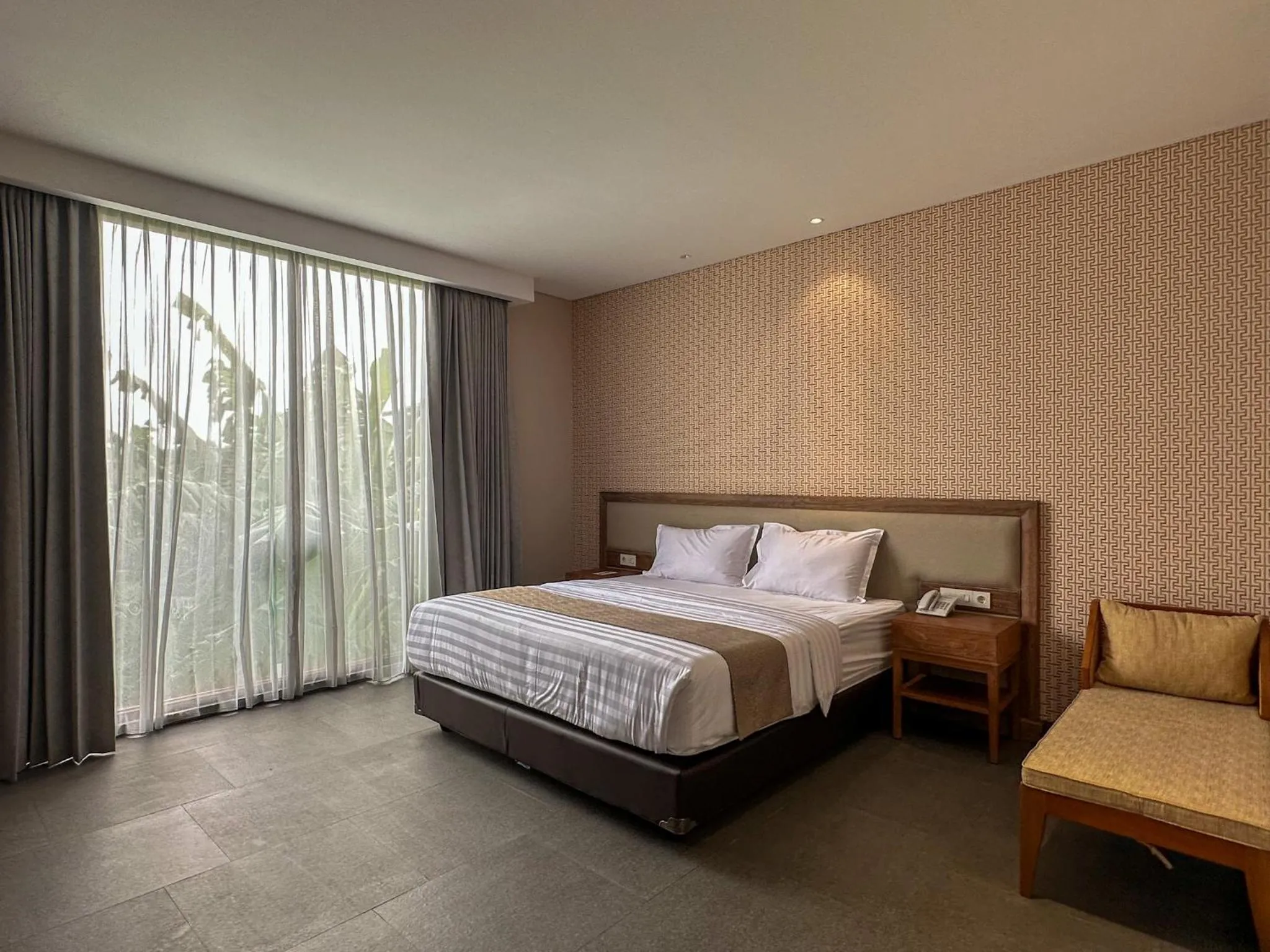 Bed in Tabebuya Resto & Resort