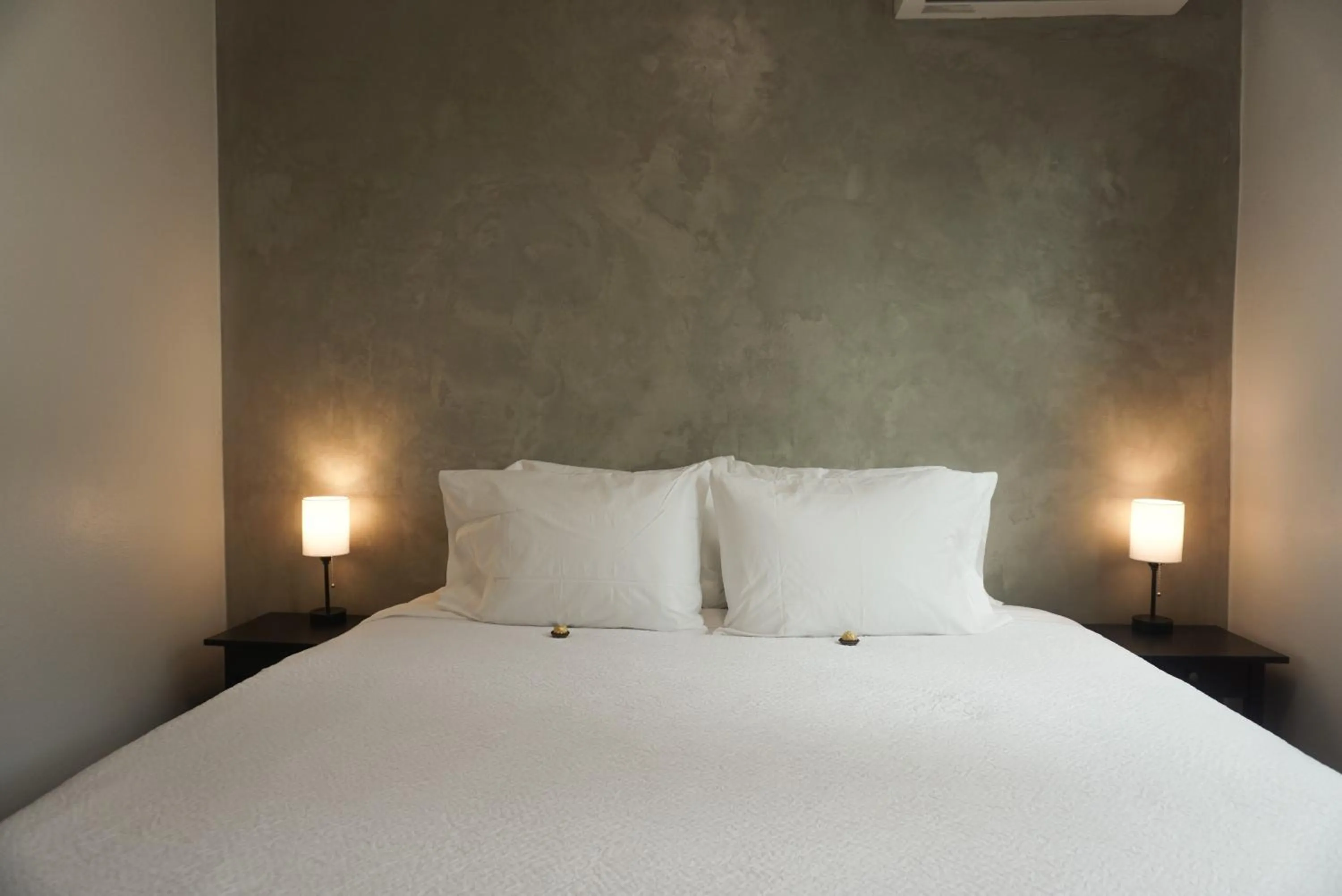 Bed in The Looking Glass Hotel