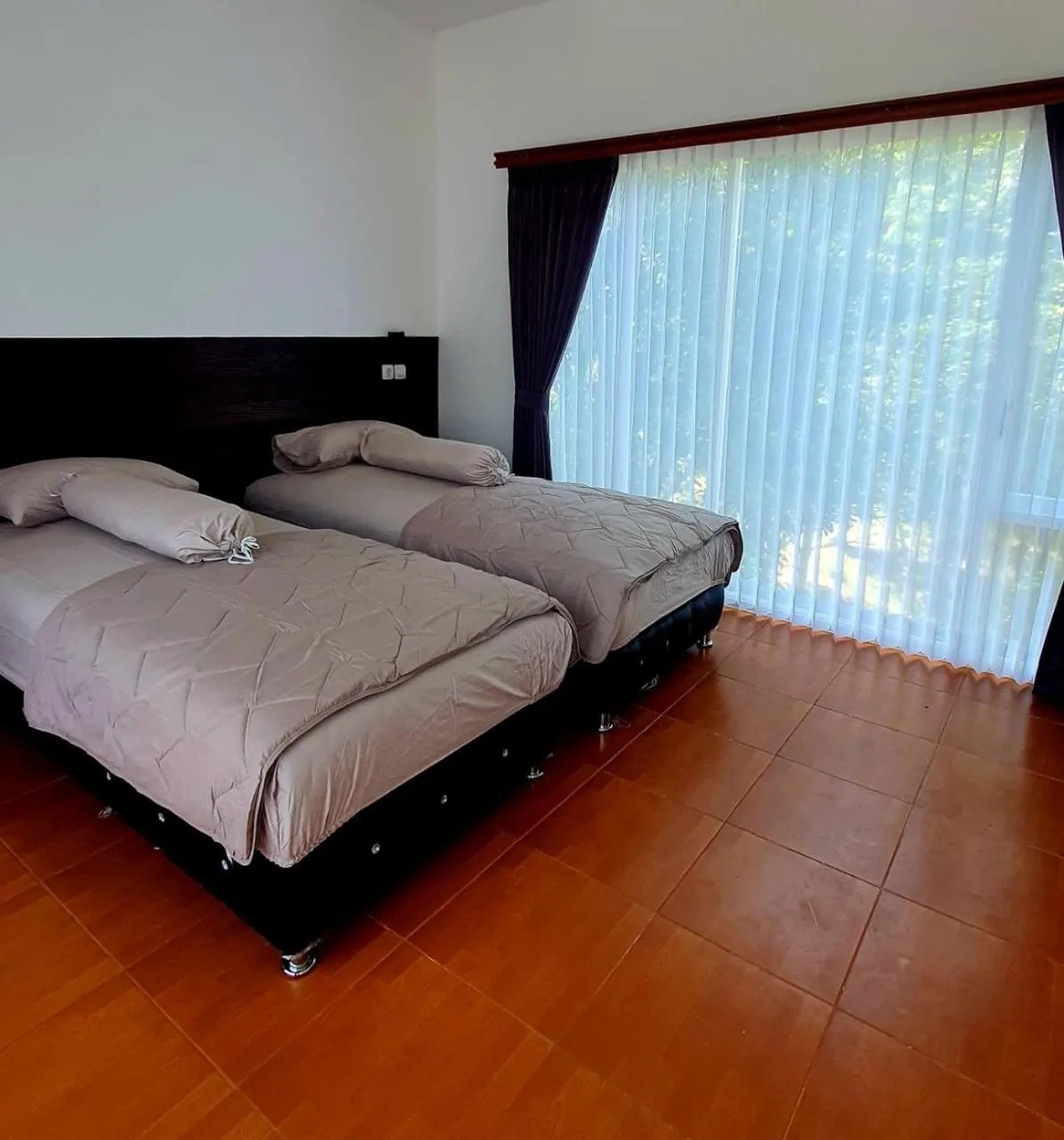 Bed in NK Villa Syariah And Cafe Prigen