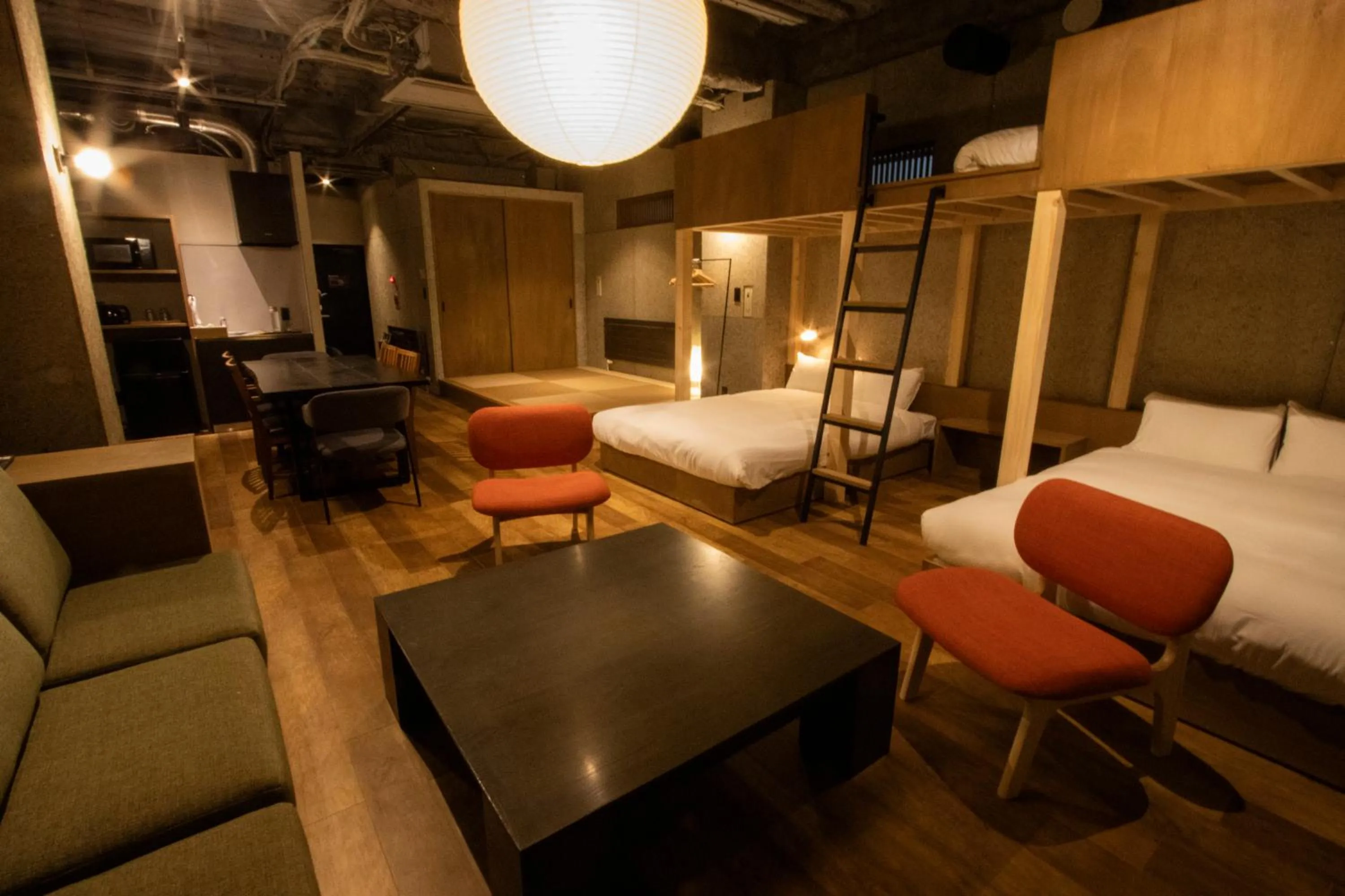 Seating area, Bed in Green Room Hotel