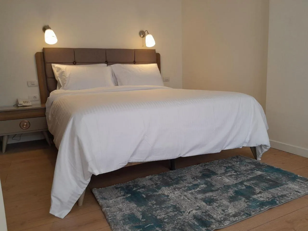 Bed in Zemilo Hotel Apartment