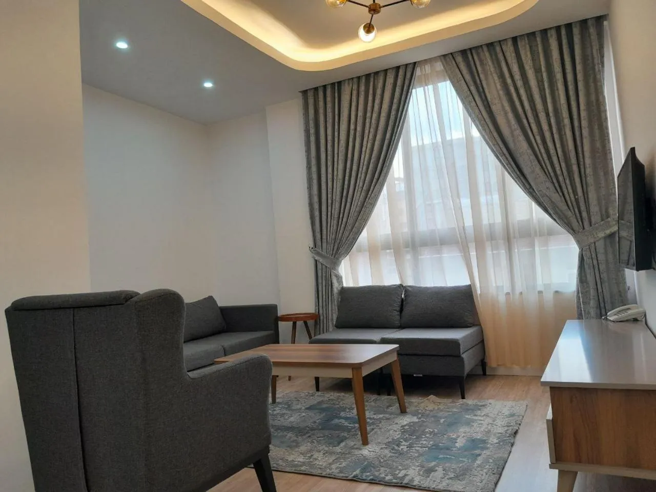 Communal lounge/ TV room in Zemilo Hotel Apartment