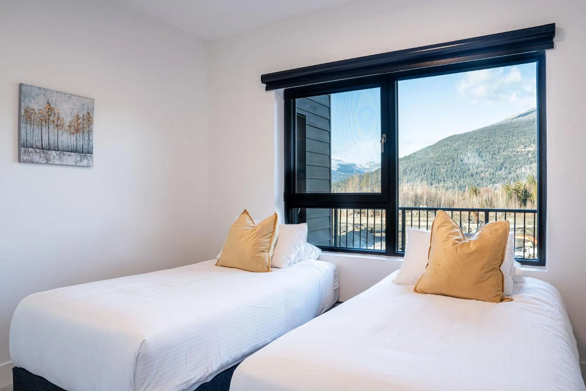 Bed in Mountainside Revival by Revelstoke Vacations