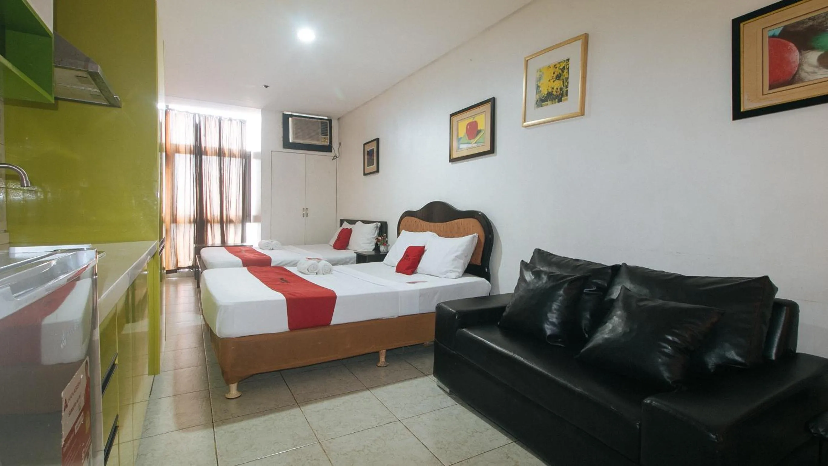 Bed in RedDoorz at TJMG by Bel Air Polaris Makati