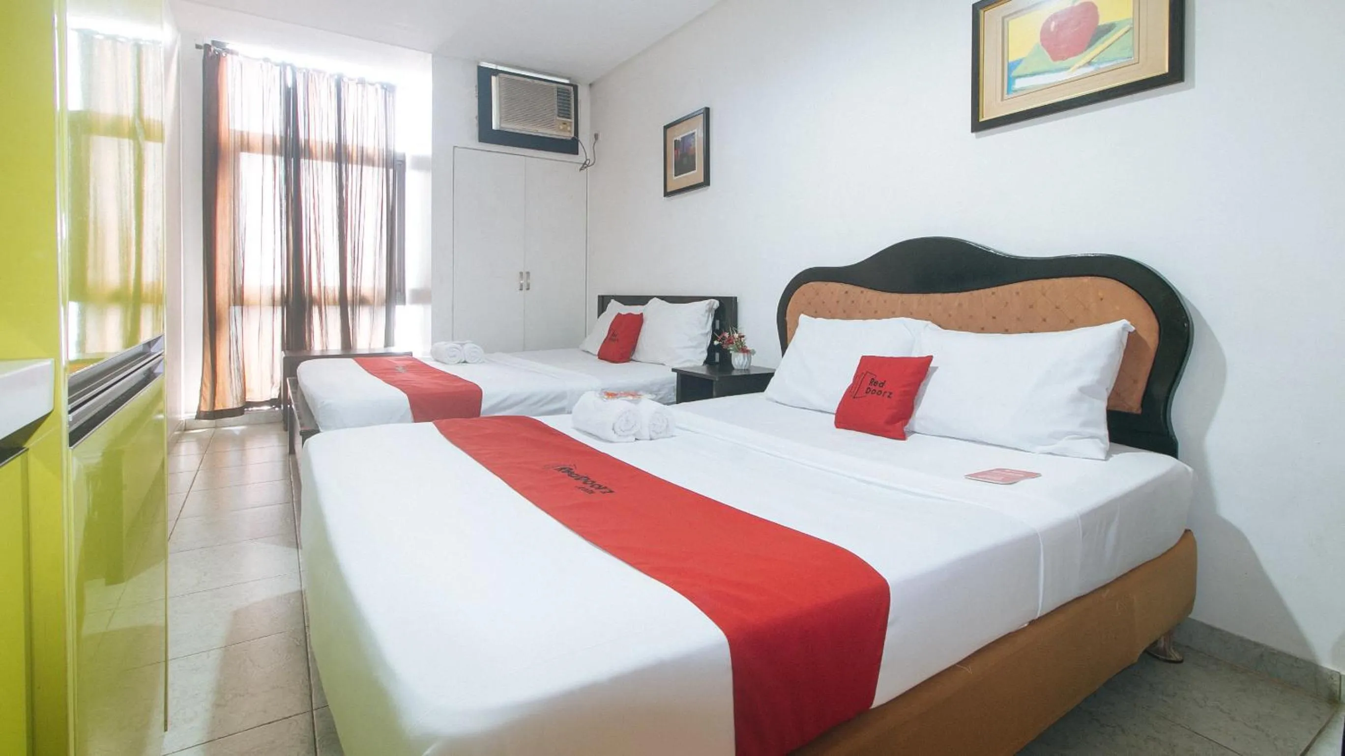 Bed in RedDoorz at TJMG by Bel Air Polaris Makati