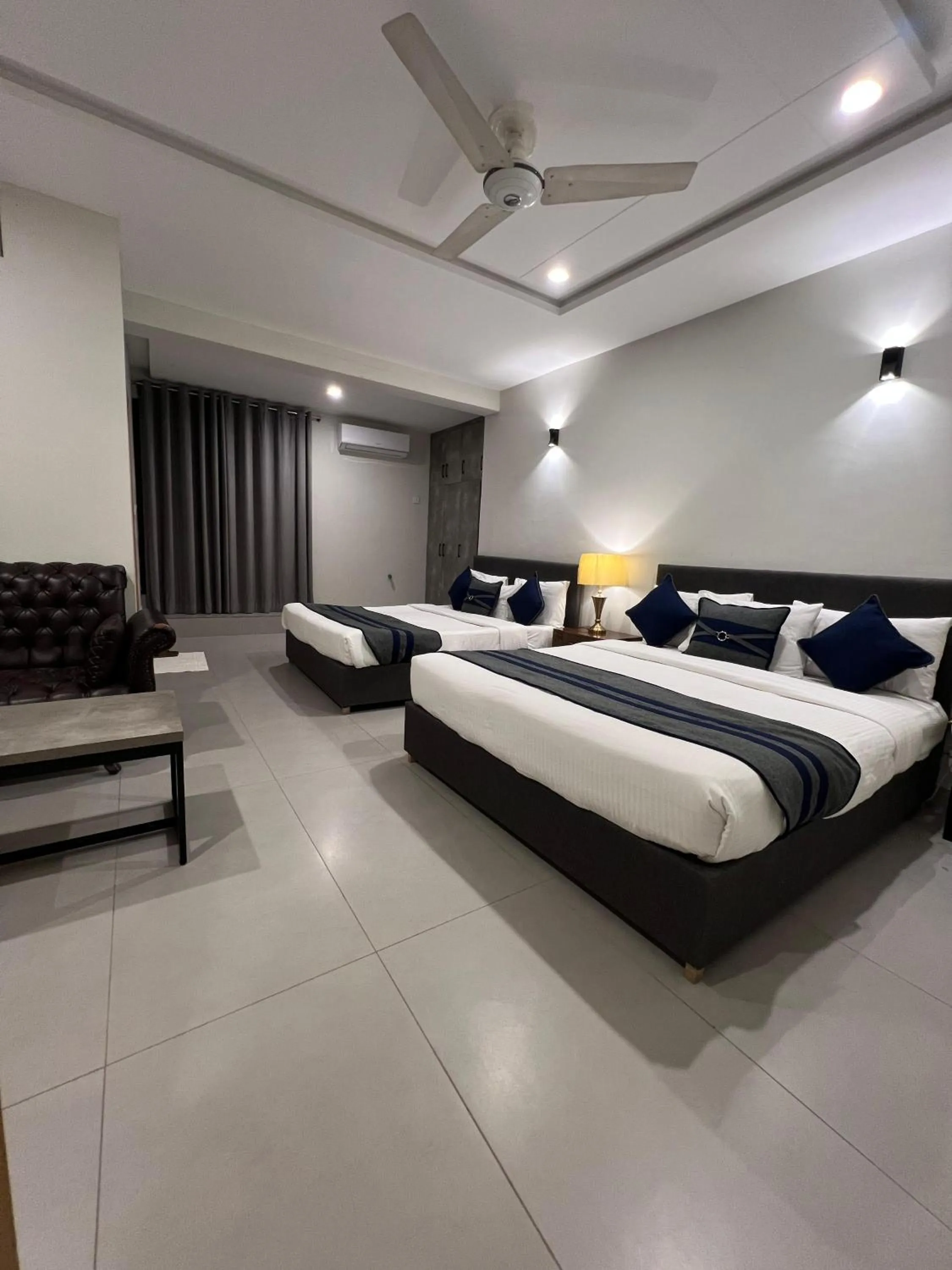 Bed in The Garden Hotel