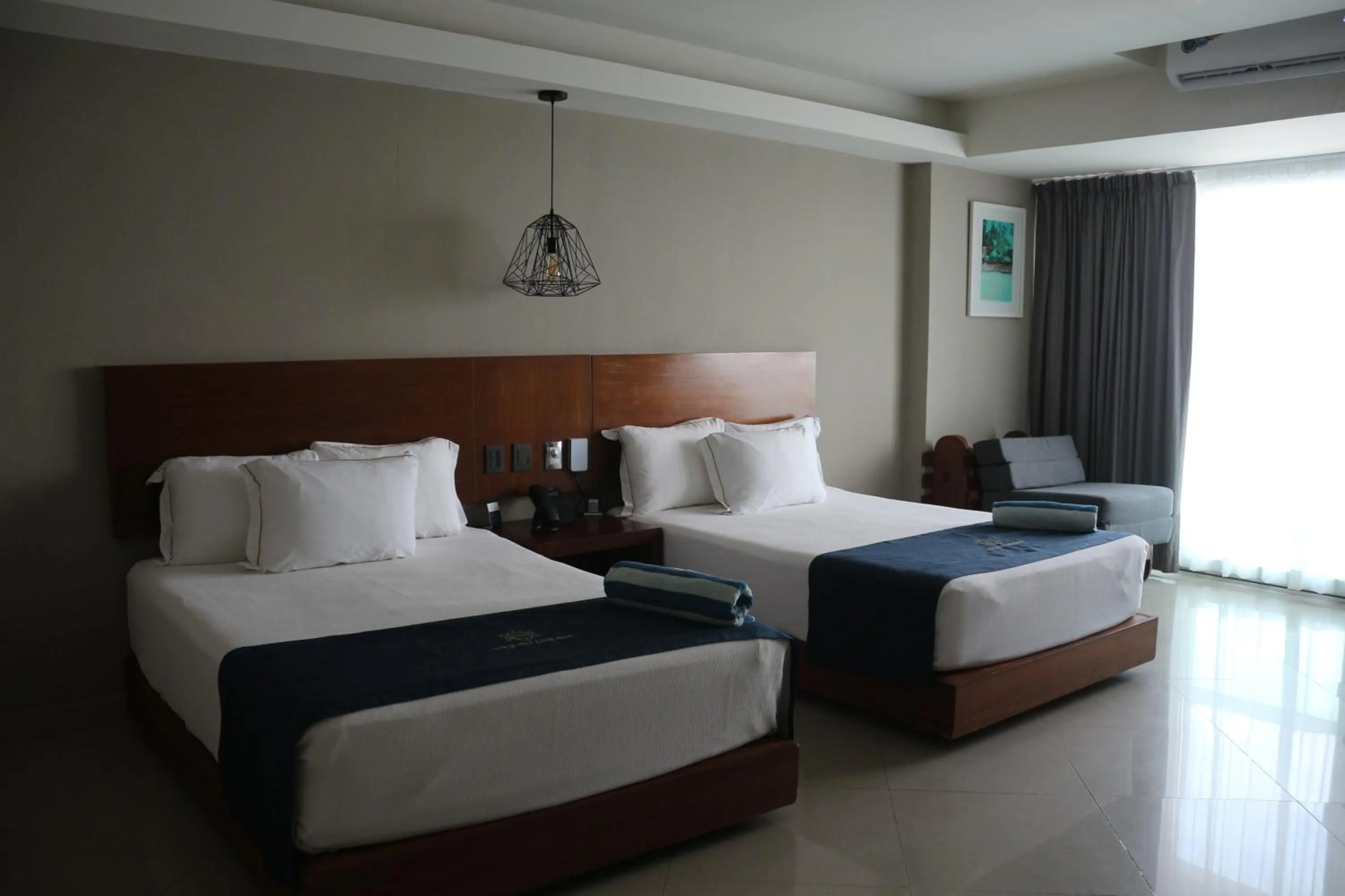 Bed in Ocean Dream Cancun by GuruHotel