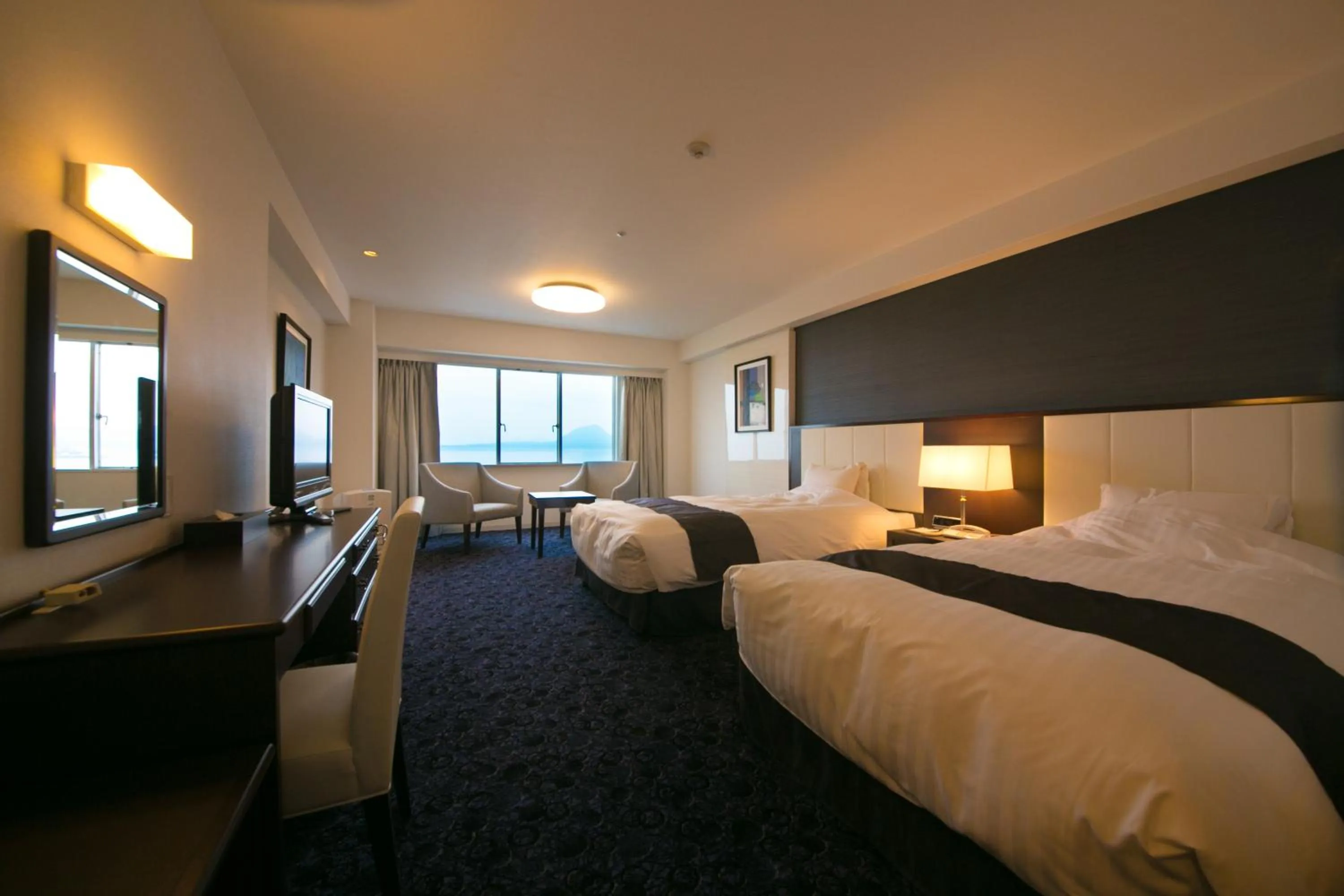 Photo of the whole room, Bed in Grand Mercure Beppu Bay Resort & Spa