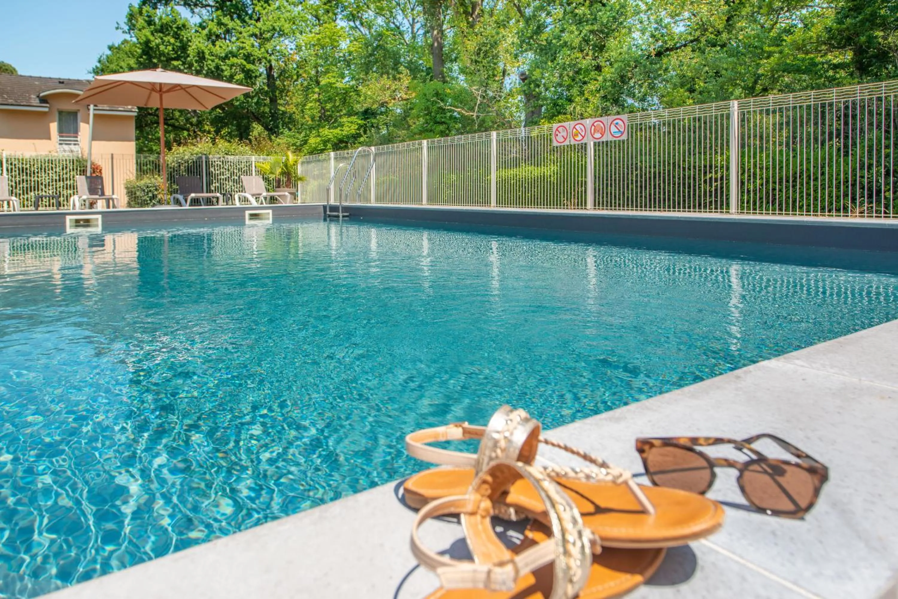 Swimming pool in Comfort Aparthotel Nantes La Beaujoire
