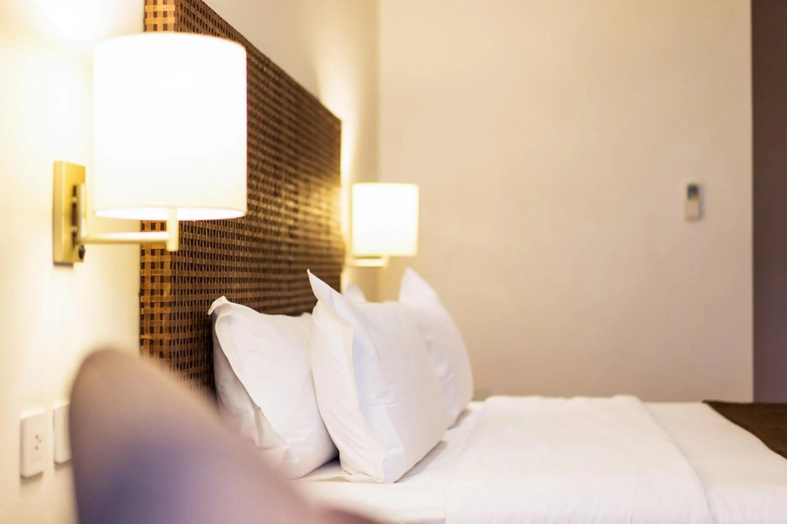 Bed in City Garden Grand Hotel