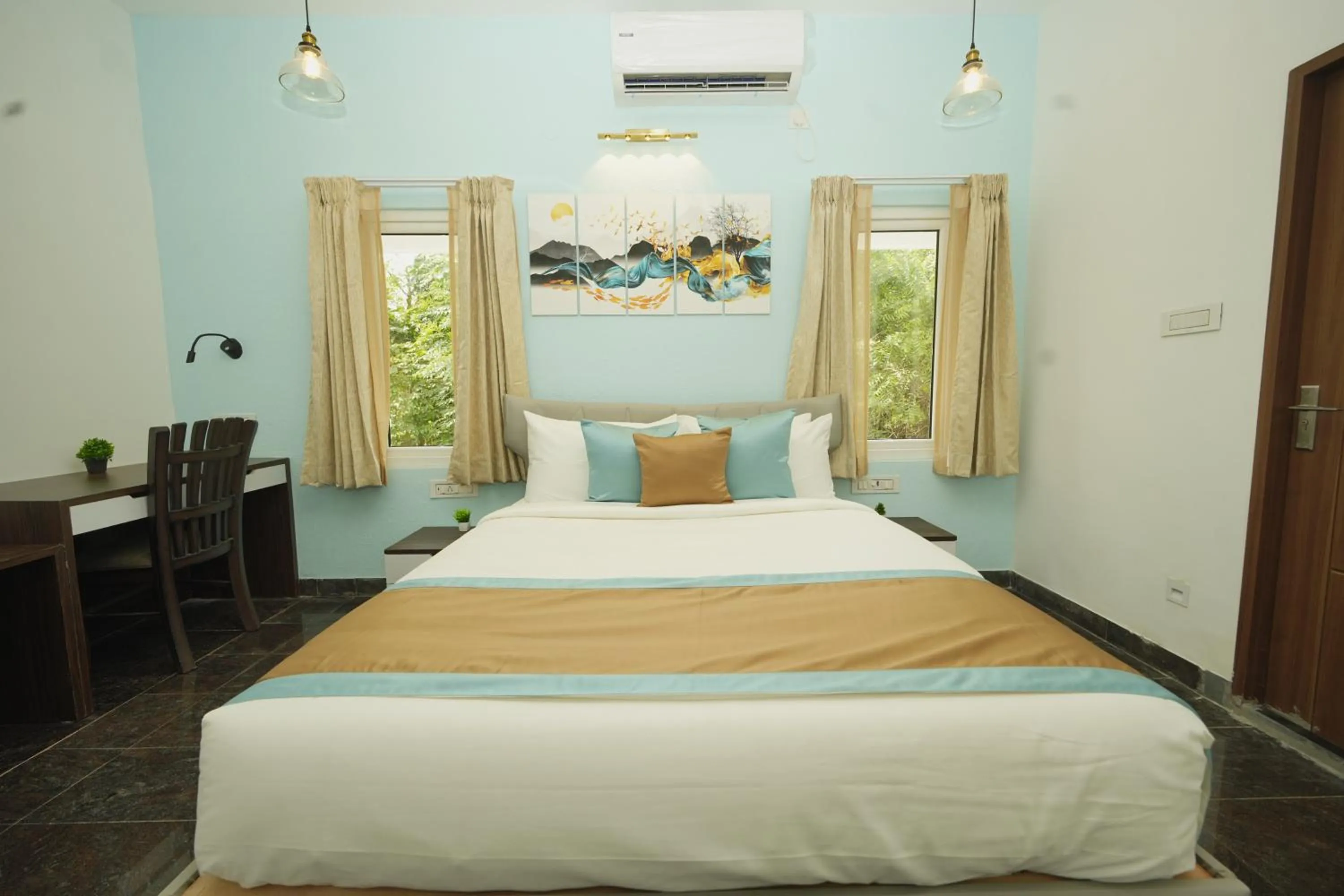 Bed in Bay Breeze Suites