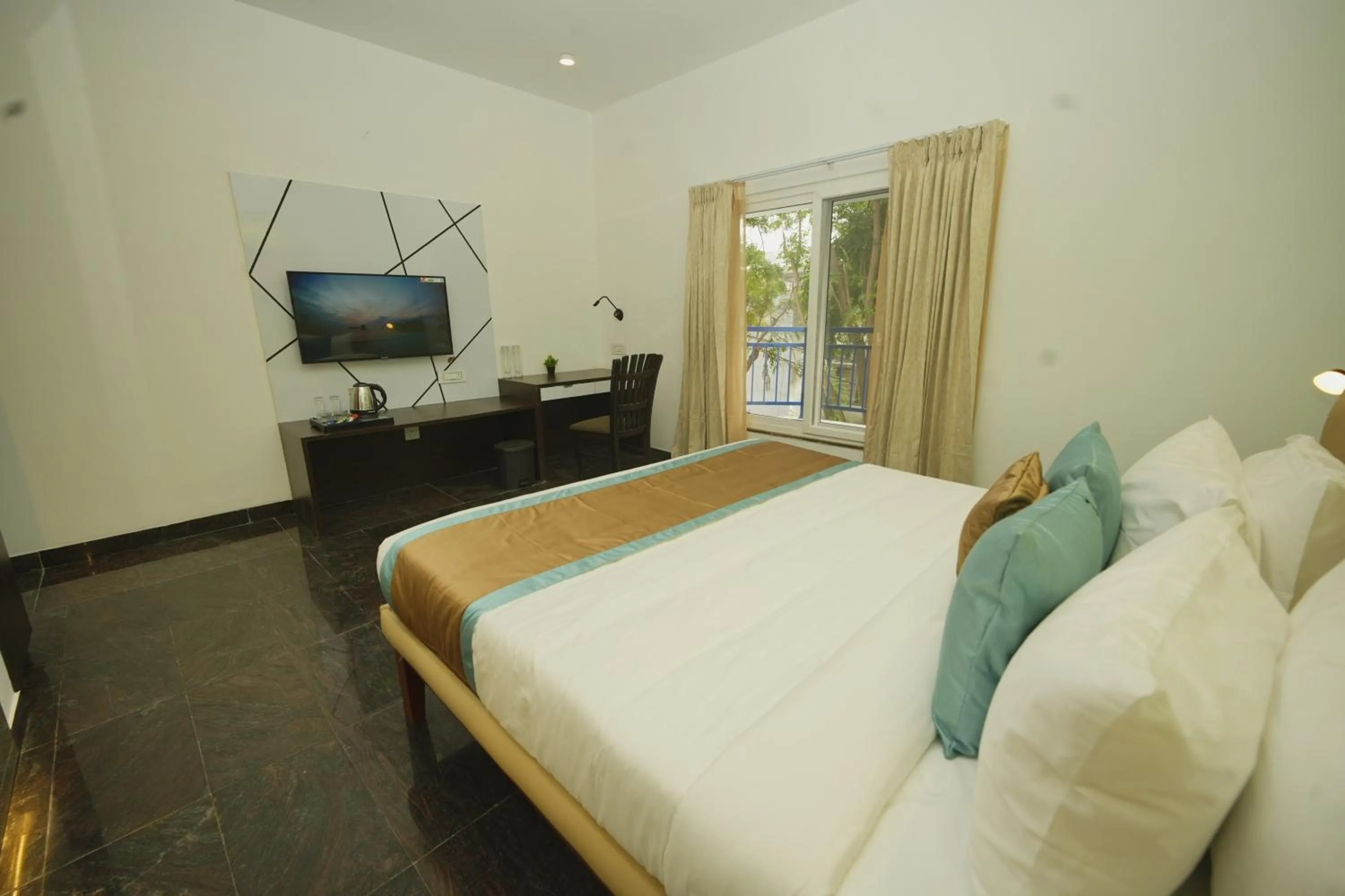 Bed in Bay Breeze Suites