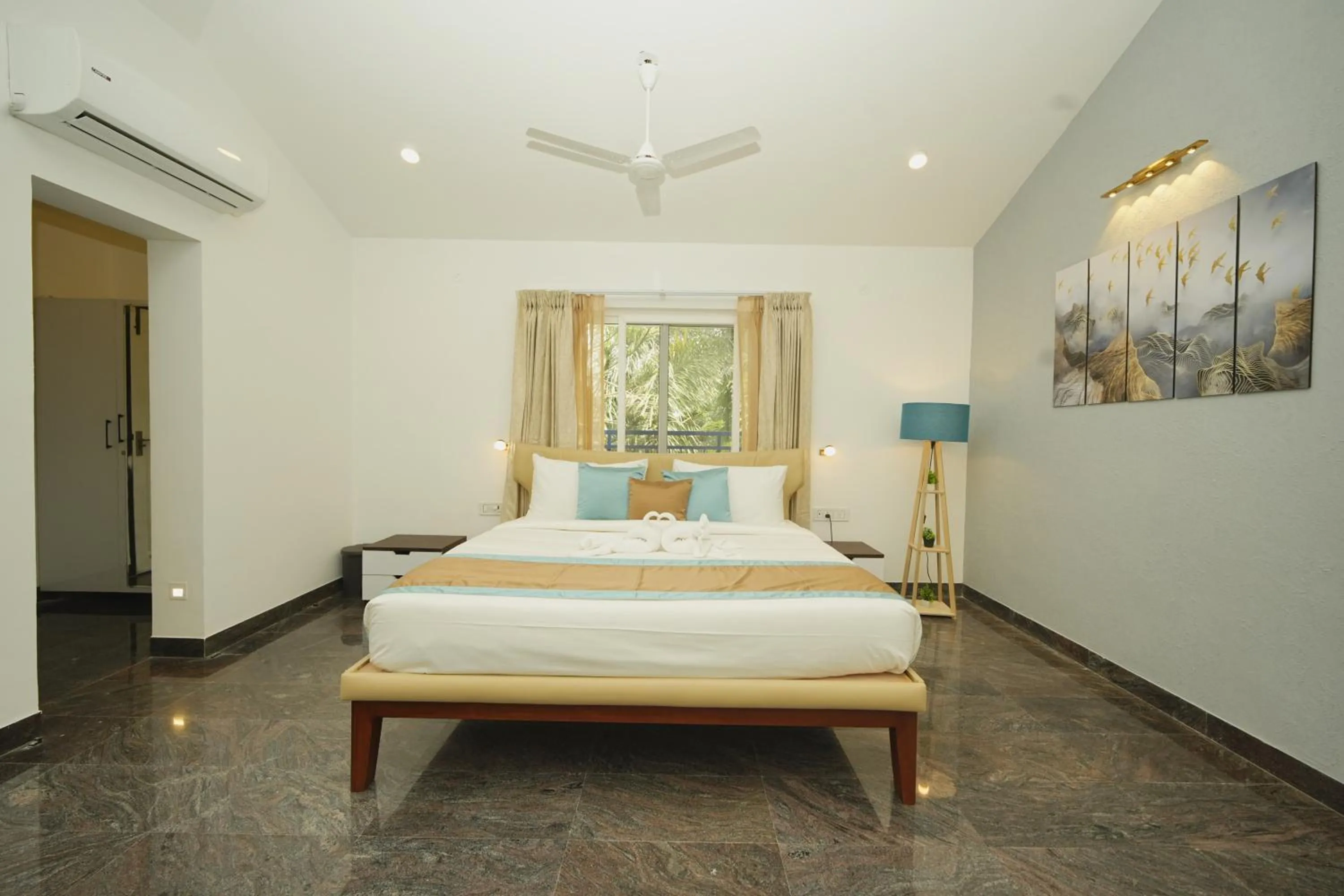 Bed in Bay Breeze Suites