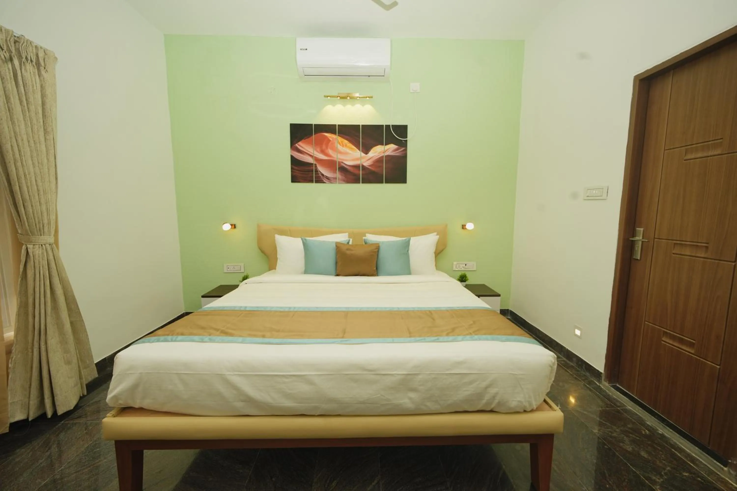 Bed in Bay Breeze Suites