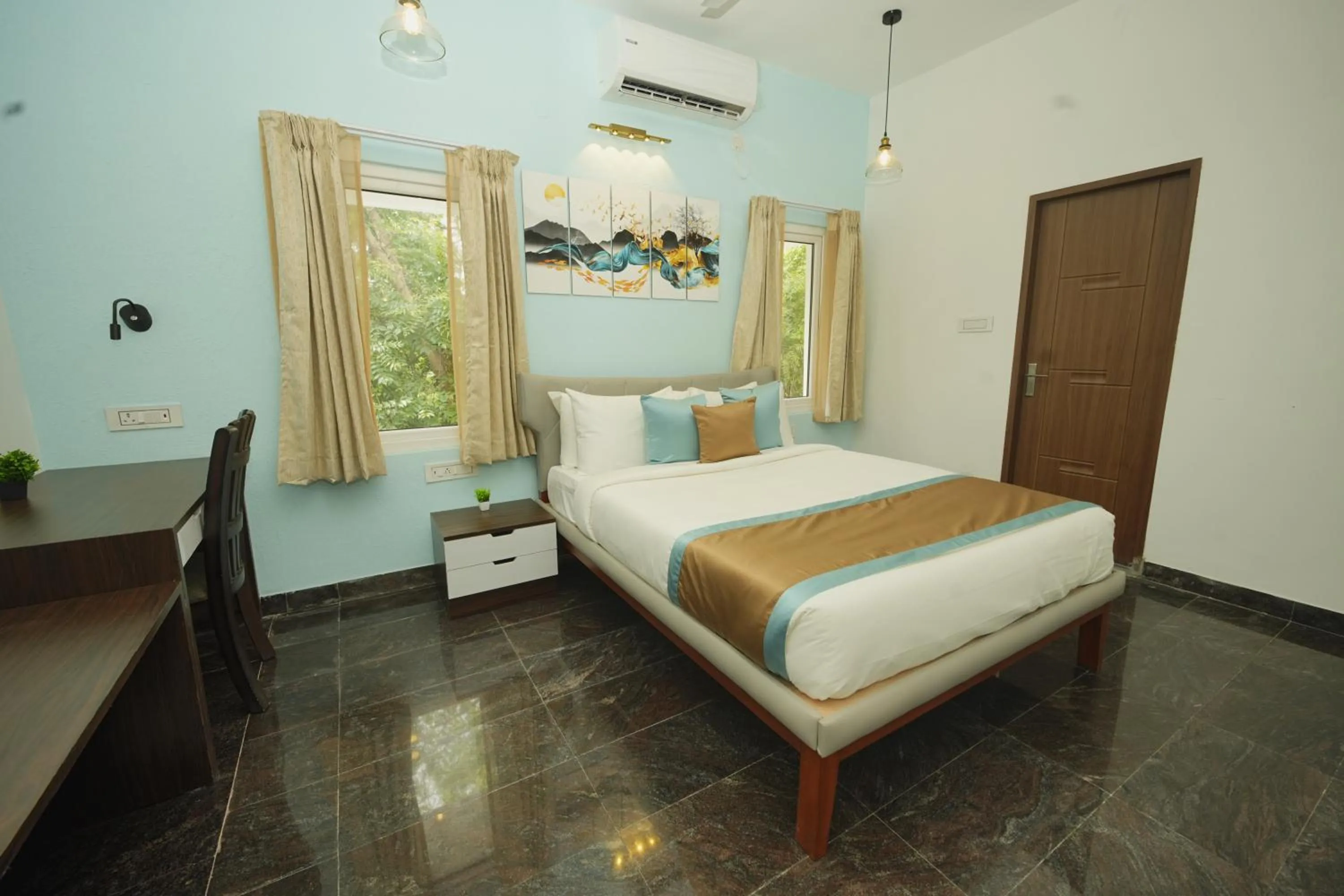 Bed in Bay Breeze Suites