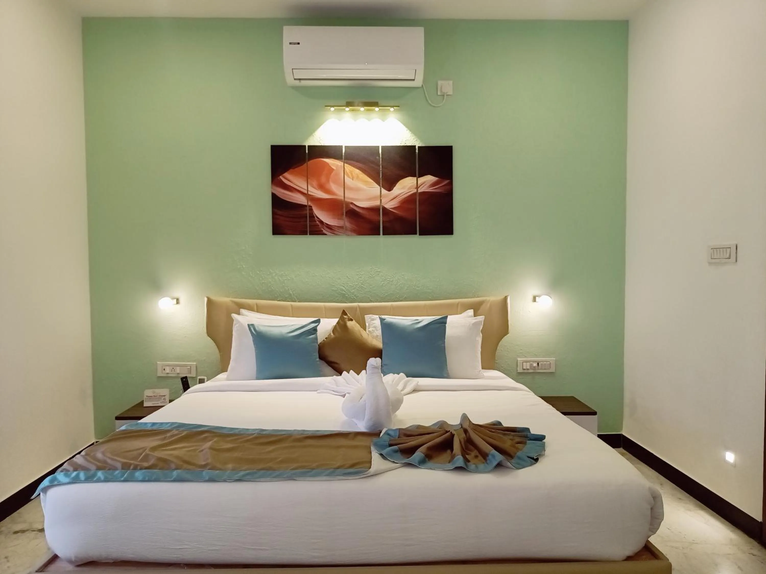 Bed in Bay Breeze Suites