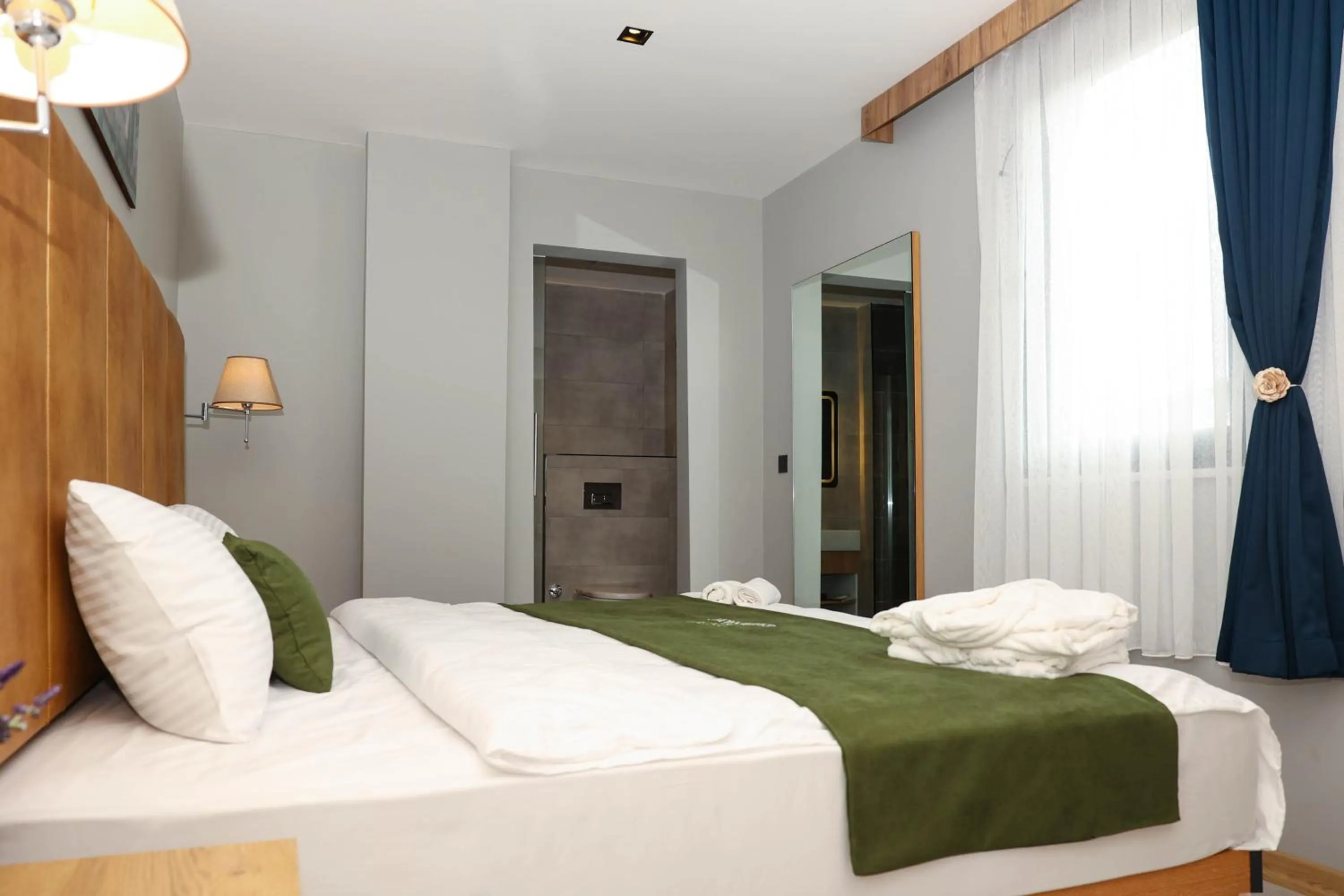 Bed in Gardenmode Airport Hotel