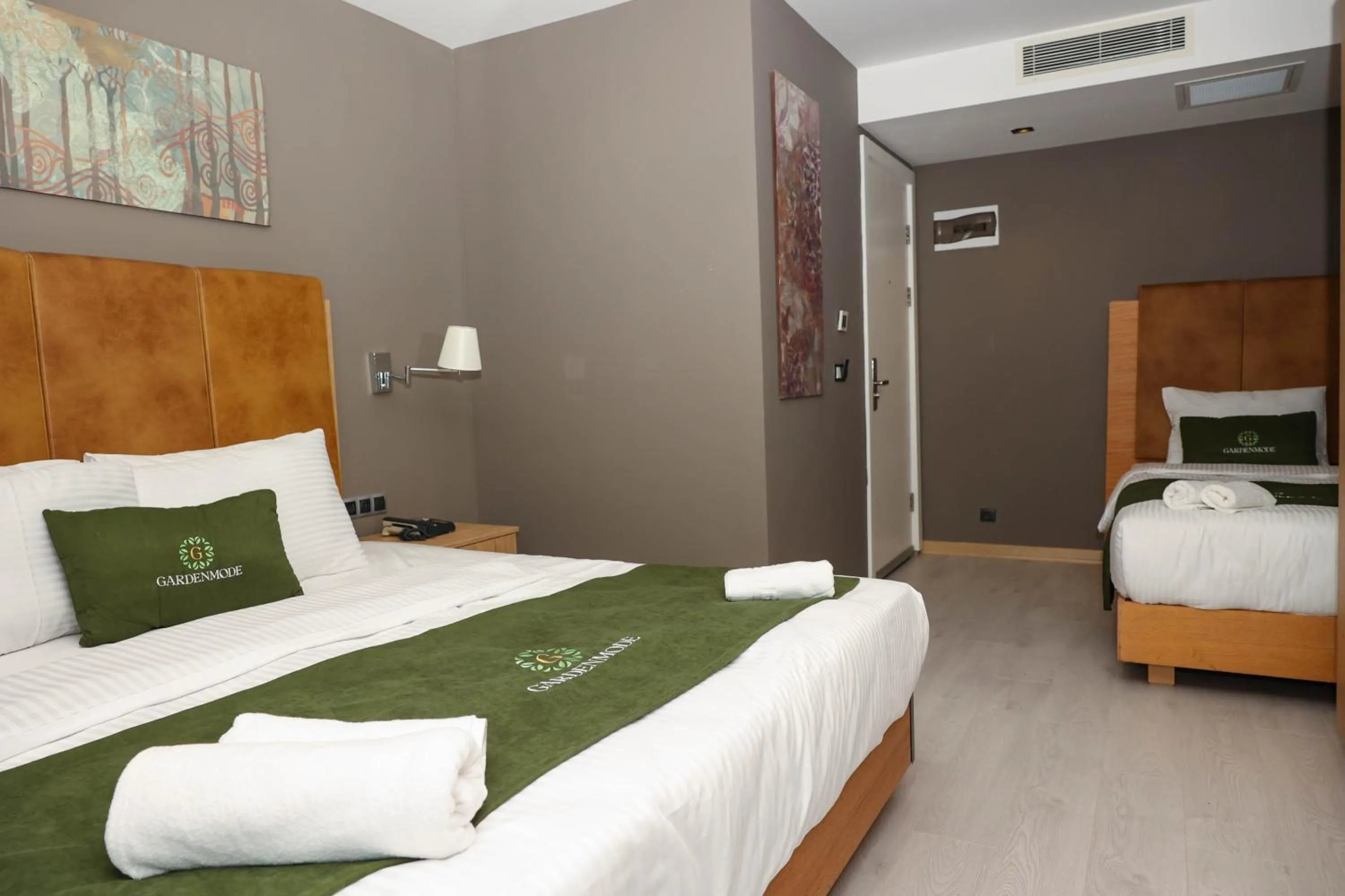 Bed in Gardenmode Airport Hotel