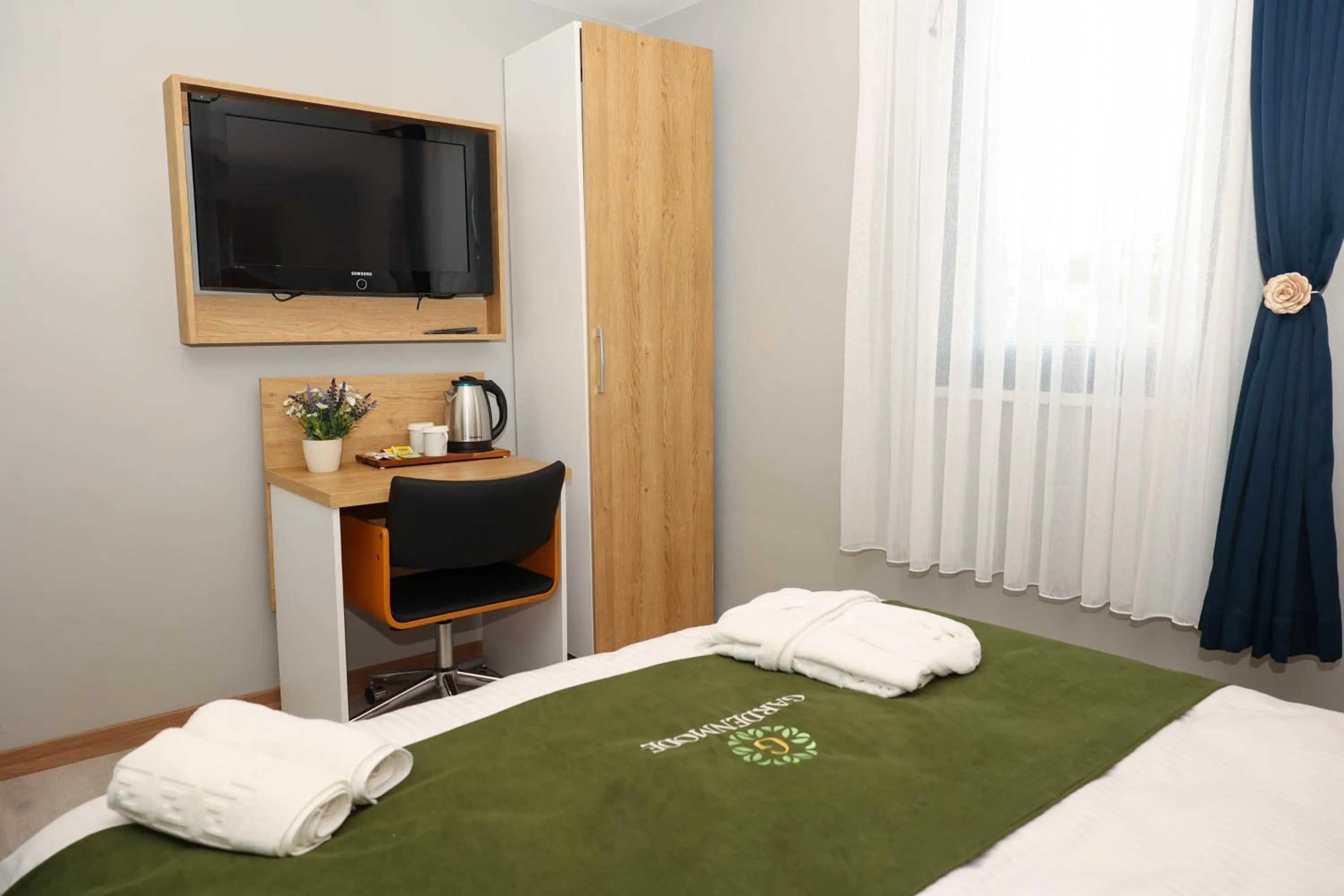 Bed in Gardenmode Airport Hotel